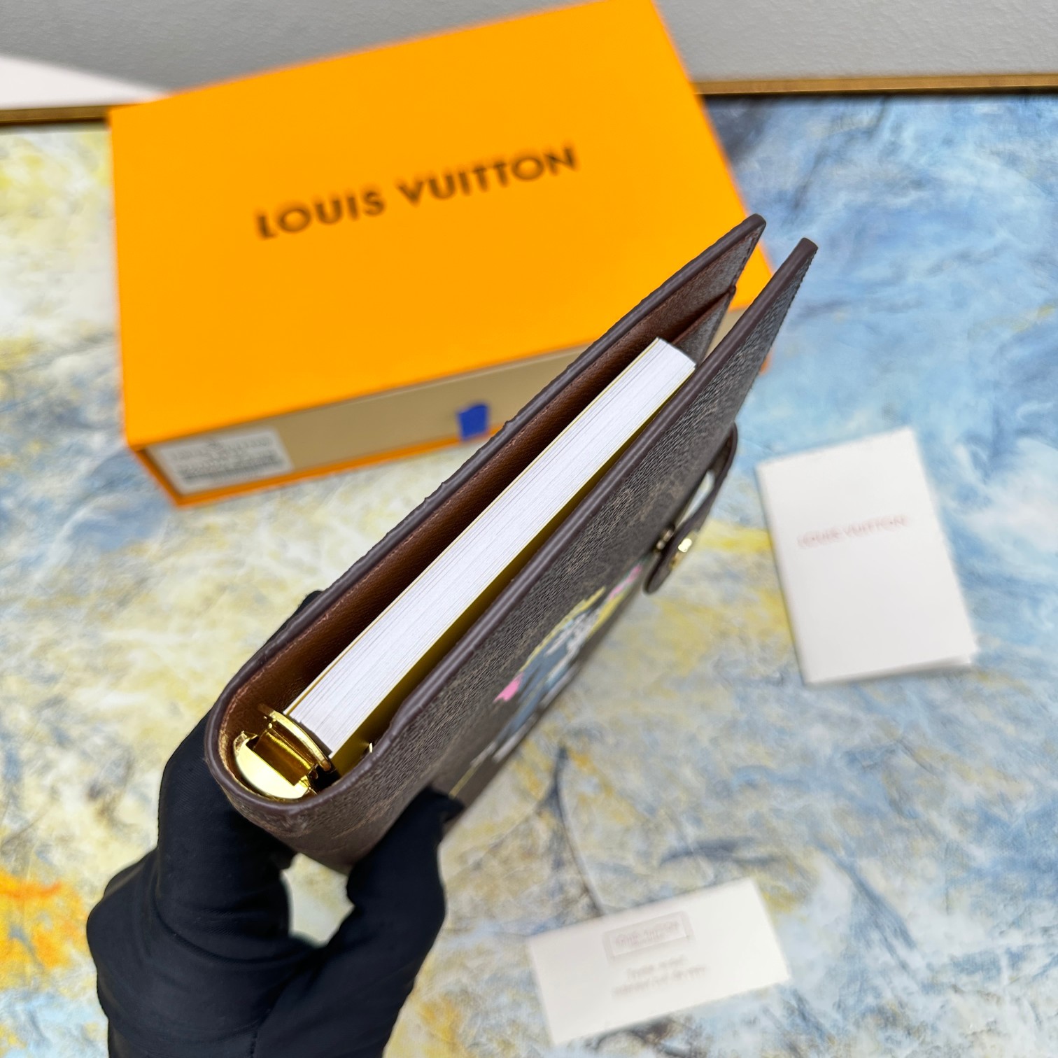 Close up of the leather texture on a small notebook