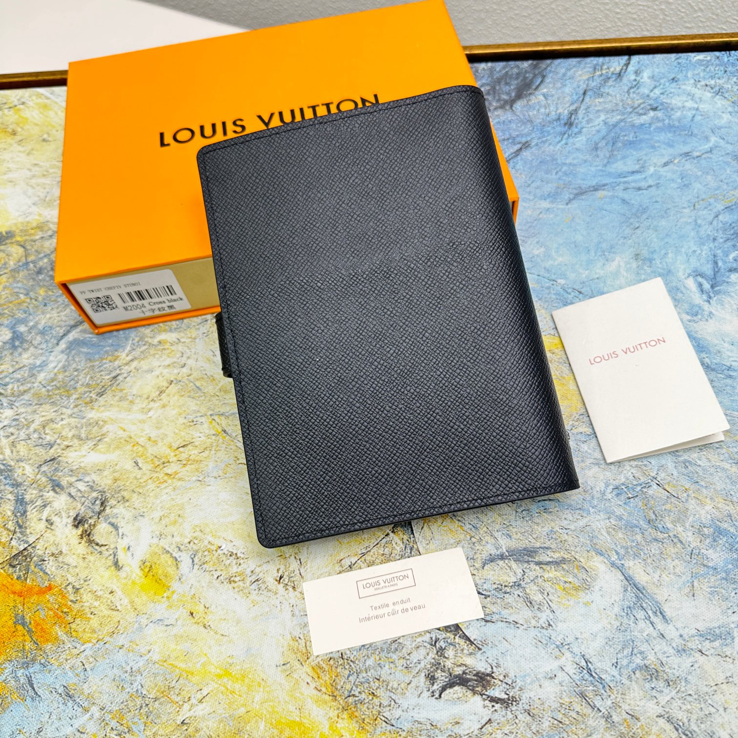 Notebook open, revealing the quality of the paper.