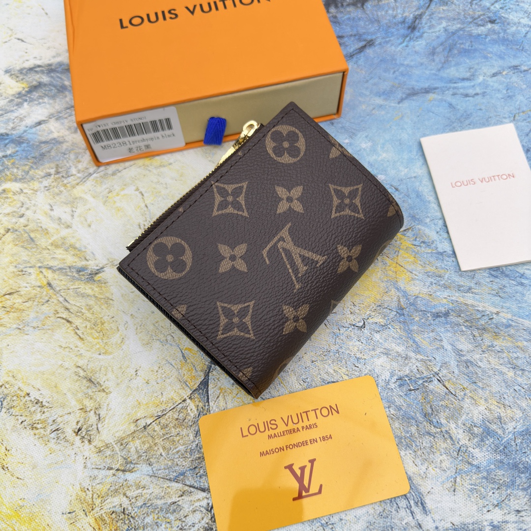 Leather bifold wallet open, showing card slots and cash compartment.