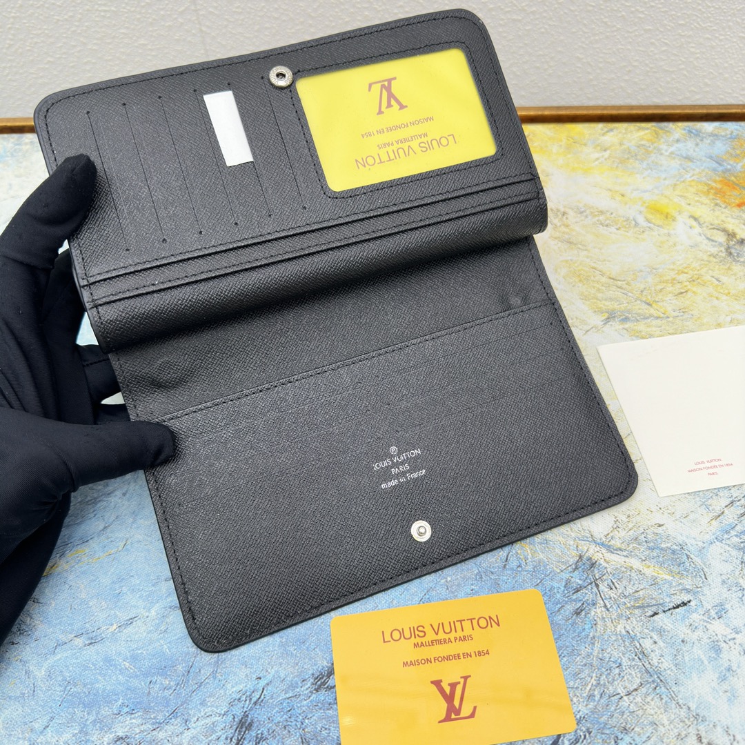 Close-up of the card slots within the classic leather long wallet