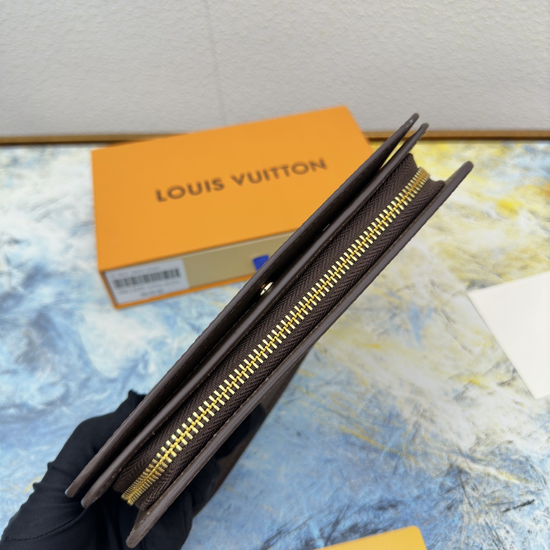 Close-up of the zipper detail on a leather long wallet