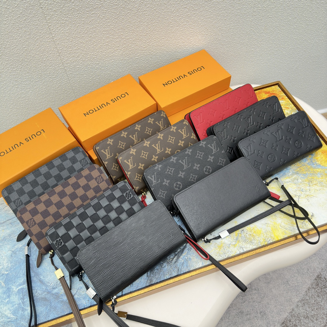 A collection of leather accessories, including a wallet, keychain, and cardholder.