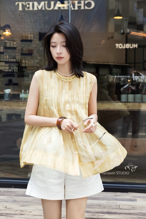 Elegant Sleeveless Pleated Blouse with Pearl and Metal Embellishments 1 Elegant Sleeveless Pleated Blouse with Pearl and Metal Embellishments