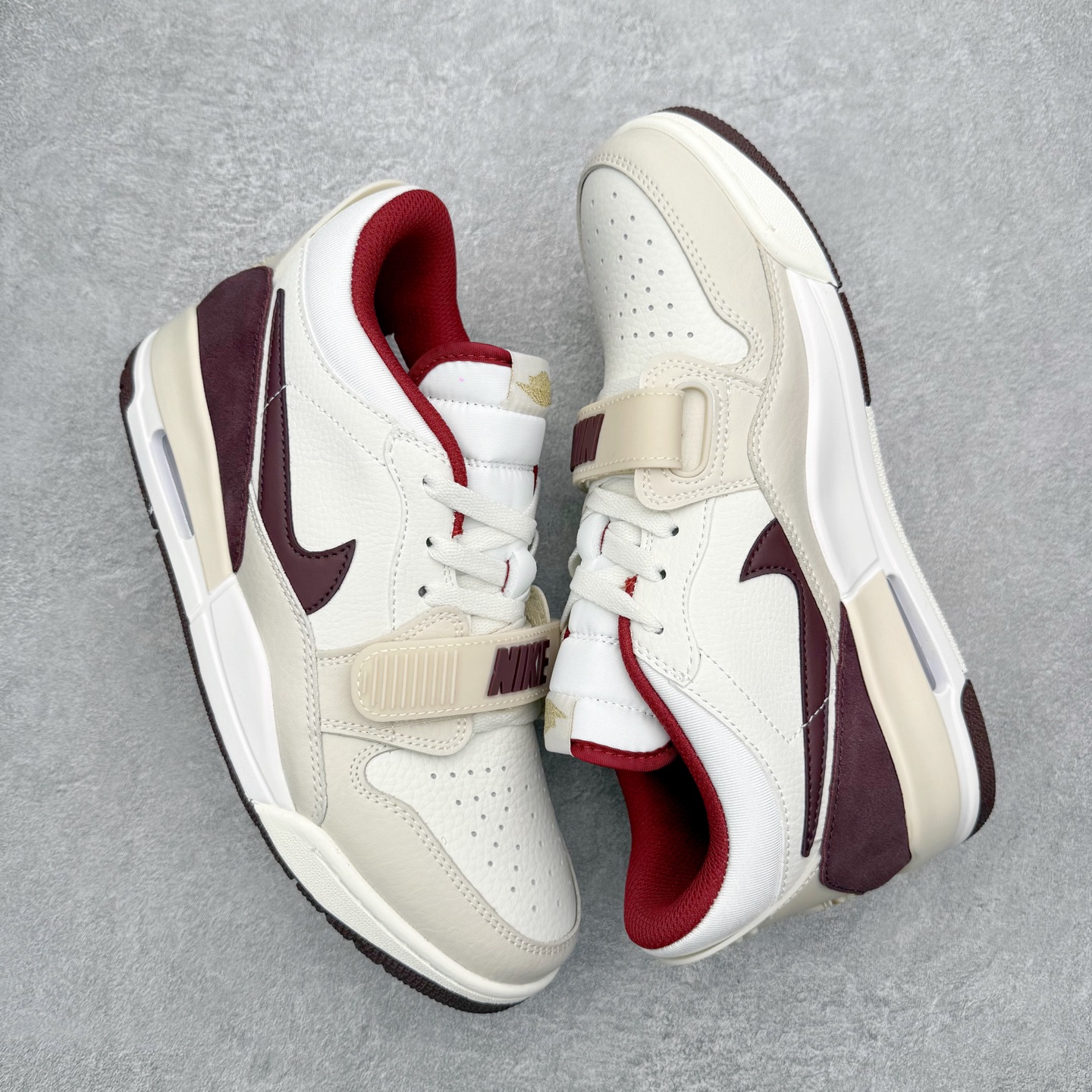 图片[3]-Air Jordan Legacy AJ312 低帮 IB4712-161 鞋身采用了皮革材质打造 横跨鞋面的魔术贴十分吸睛 侧面的Swoosh Logo的一部分被鞋面遮挡了一部分 颇具玩味 魔术贴上标有NK标识 而鞋舌上是Jordan的经典飞翼Logo 后跟和鞋底均采用了Air Jordan 3 的设计 后跟上同样也使用了经典的爆裂纹图案 尺码：36 36.5 37.5 38 38.5 39 40 40.5 41 42 42.5 43 44 44.5 45 46 47.5-选品中心