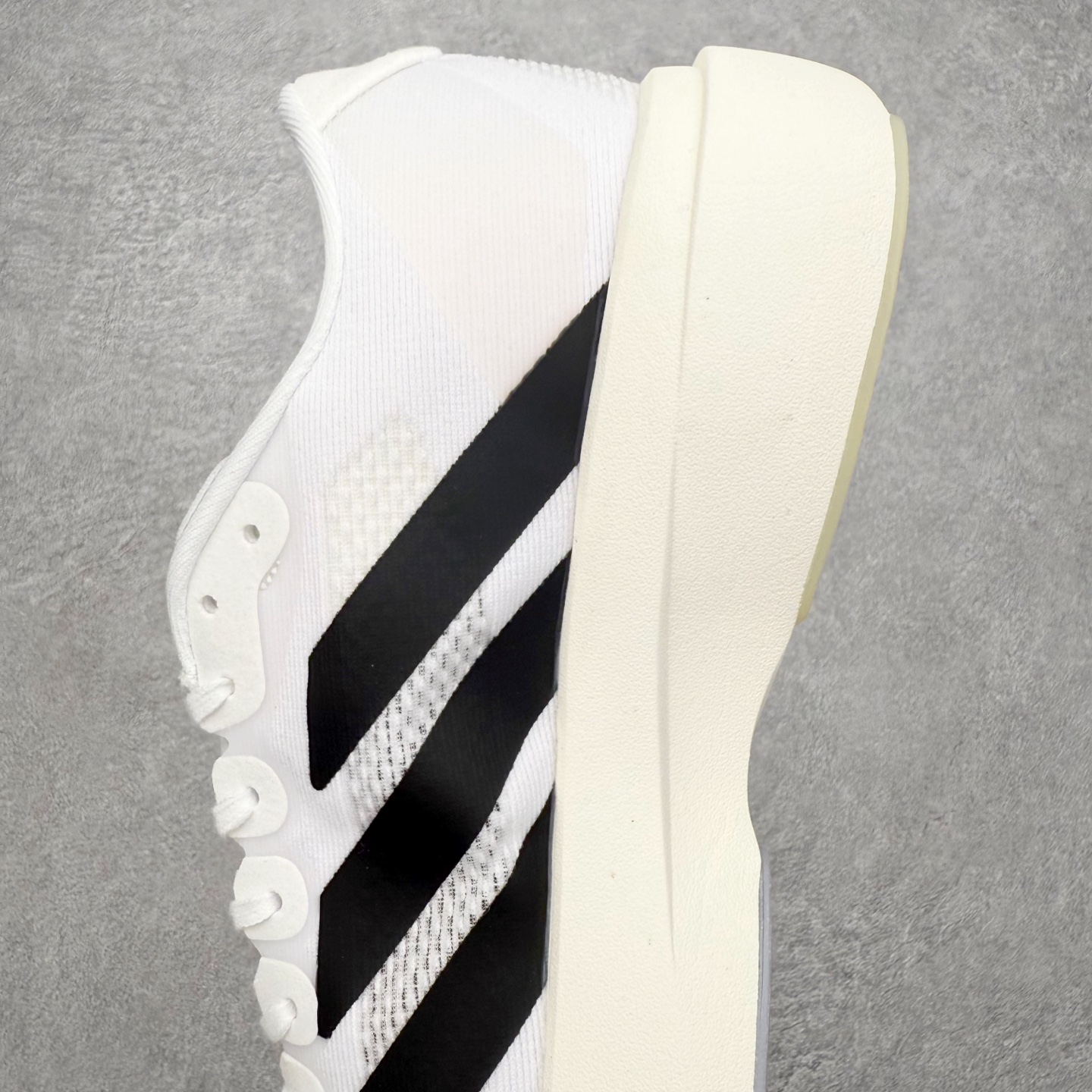 图片[7]-＃福利特价 AD Adizero EVO SL 马拉松竞速专业跑鞋 CELERMESH针织网面非常轻薄 纤维间的缝隙很大 可以保证跑步时的透气、排汗效果 鞋舌直接与两侧的内衬和鞋底连接在一起 在跑步过程中不会被鞋舌的左右移动所困扰 在标准鞋带孔的基础上再拓宽一组鞋带孔 适合不同脚型的需求 突破性 EnergyRods 技术，有助于跑者实现更好的成绩 中底独特的LIGHTSTRIKE PRO泡棉材质 微弹感觉在跑步过程中给予了良好的支撑体验 对于顶级精英和高水平进阶跑者来说 ADIOS PRO是一双值得信赖的竞速比赛用鞋 尺码：36 36.5 37.5 38 38.5 39 40 40.5 41 42 42.5 43 44 44.5 45-选品中心