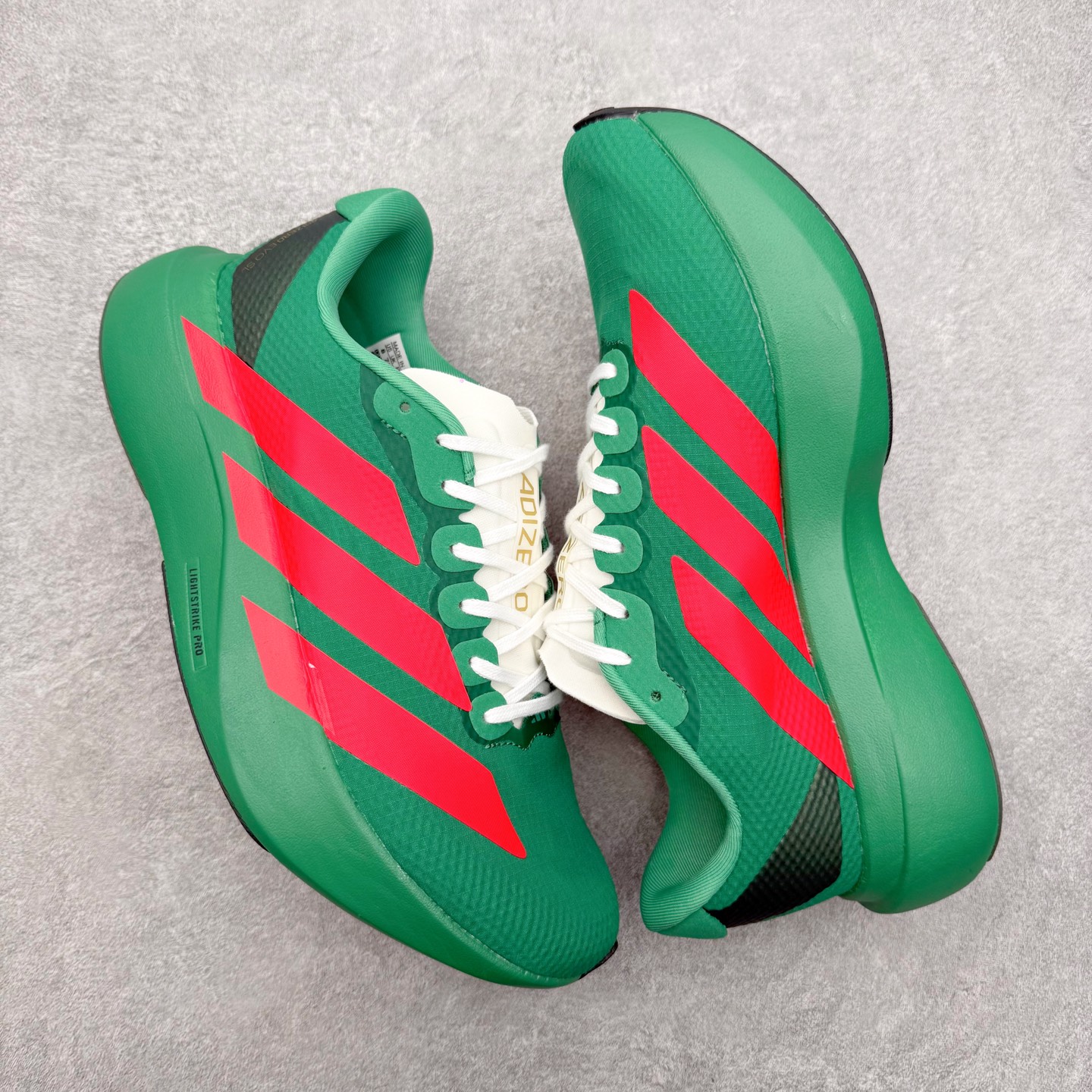 图片[3]-AD Adizero EVO SL WOVEN 马拉松竞速专业跑鞋 CELERMESH针织网面非常轻薄 纤维间的缝隙很大 可以保证跑步时的透气、排汗效果 鞋舌直接与两侧的内衬和鞋底连接在一起 在跑步过程中不会被鞋舌的左右移动所困扰 在标准鞋带孔的基础上再拓宽一组鞋带孔 适合不同脚型的需求 突破性 EnergyRods 技术，有助于跑者实现更好的成绩 中底独特的LIGHTSTRIKE PRO泡棉材质 微弹感觉在跑步过程中给予了良好的支撑体验 对于顶级精英和高水平进阶跑者来说 ADIOS PRO是一双值得信赖的竞速比赛用鞋 尺码：36 36.5 37.5 38 38.5 39 40 40.5 41 42 42.5 43 44 44.5 45-选品中心