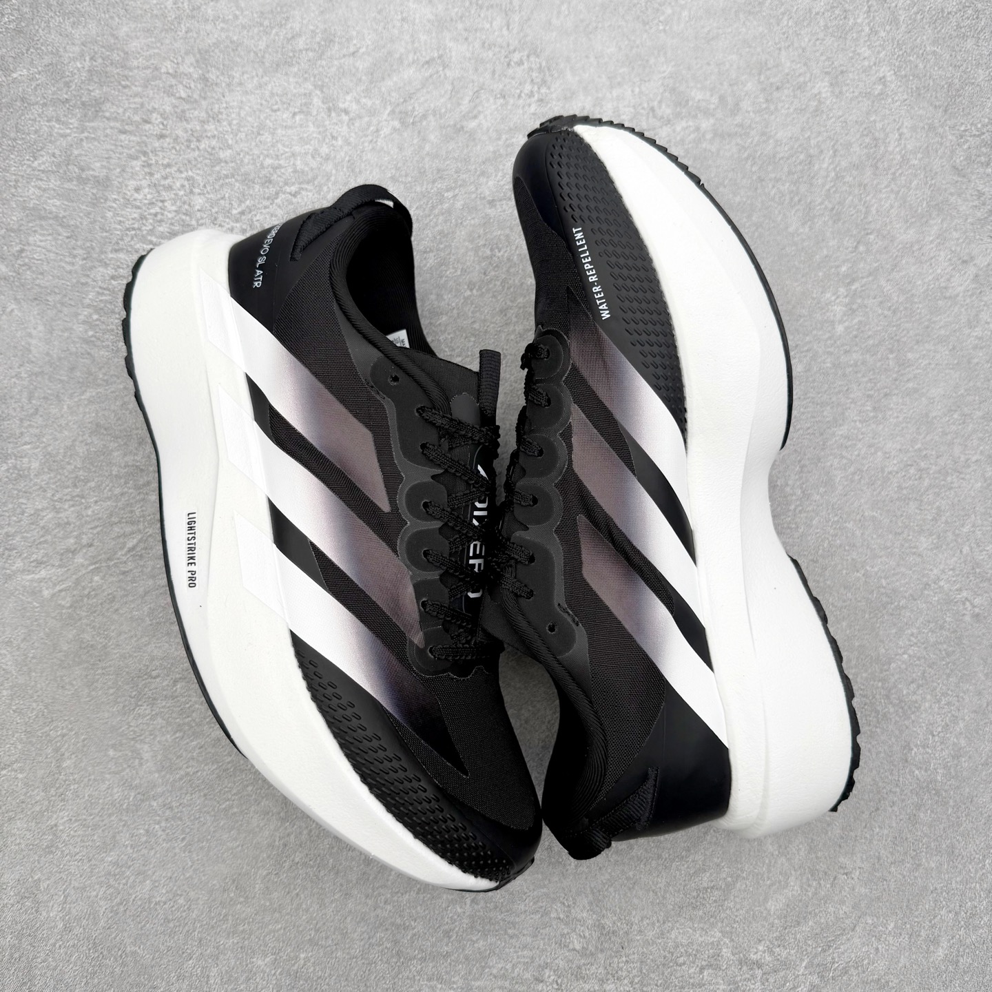 图片[3]-AD Adizero EVO SL ATR M 马拉松竞速专业跑鞋 CELERMESH针织网面非常轻薄 纤维间的缝隙很大 可以保证跑步时的透气、排汗效果 鞋舌直接与两侧的内衬和鞋底连接在一起 在跑步过程中不会被鞋舌的左右移动所困扰 在标准鞋带孔的基础上再拓宽一组鞋带孔 适合不同脚型的需求 突破性 EnergyRods 技术，有助于跑者实现更好的成绩 中底独特的LIGHTSTRIKE PRO泡棉材质 微弹感觉在跑步过程中给予了良好的支撑体验 对于顶级精英和高水平进阶跑者来说 ADIOS PRO是一双值得信赖的竞速比赛用鞋 尺码：36 36.5 37.5 38 38.5 39 40 40.5 41 42 42.5 43 44 44.5 45-选品中心
