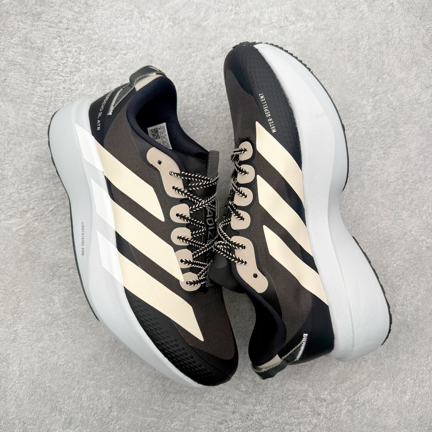 图片[3]-AD Adizero EVO SL ATR M 马拉松竞速专业跑鞋 CELERMESH针织网面非常轻薄 纤维间的缝隙很大 可以保证跑步时的透气、排汗效果 鞋舌直接与两侧的内衬和鞋底连接在一起 在跑步过程中不会被鞋舌的左右移动所困扰 在标准鞋带孔的基础上再拓宽一组鞋带孔 适合不同脚型的需求 突破性 EnergyRods 技术，有助于跑者实现更好的成绩 中底独特的LIGHTSTRIKE PRO泡棉材质 微弹感觉在跑步过程中给予了良好的支撑体验 对于顶级精英和高水平进阶跑者来说 ADIOS PRO是一双值得信赖的竞速比赛用鞋 尺码：36 36.5 37.5 38 38.5 39 40 40.5 41 42 42.5 43 44 44.5 45-选品中心