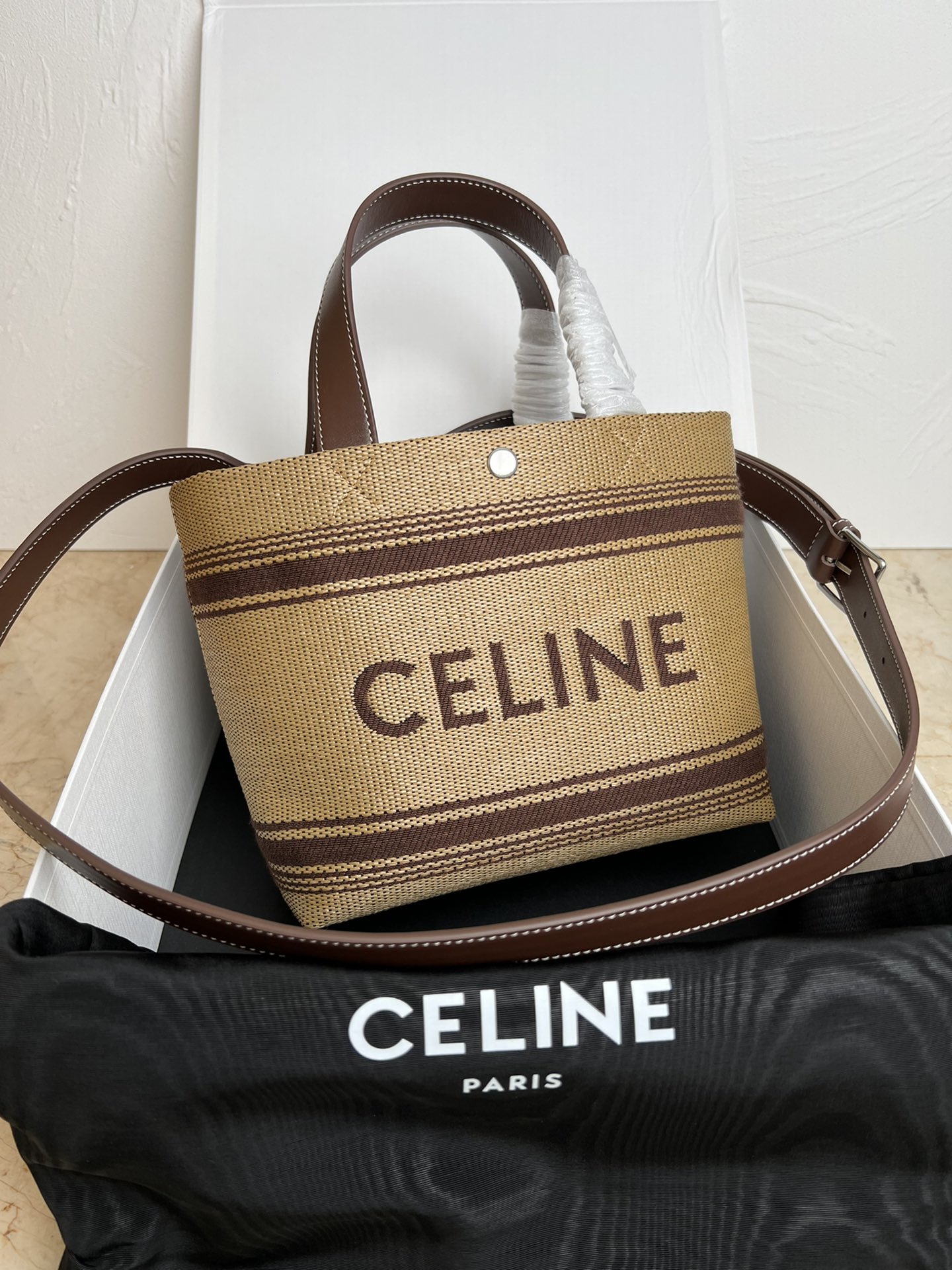 NO:199946,New products are launched, CE's new fabric series handbags, mini leather trim logo, fabric contrast letter logo, snap button opening and closing, hand-held shoulder crossbody, 24 new woven bag 