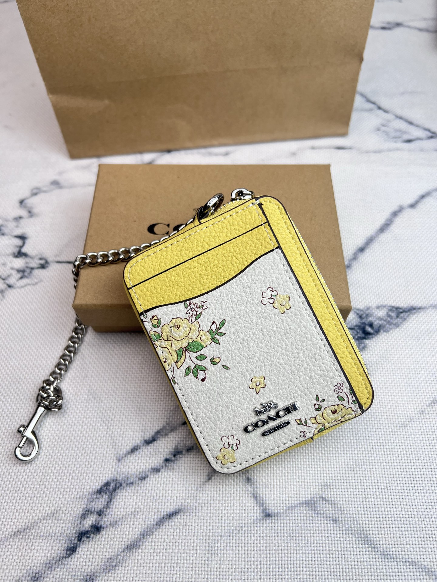 Coach ～COACH蔻驰 CAU44荔枝纹黄色花卉印花