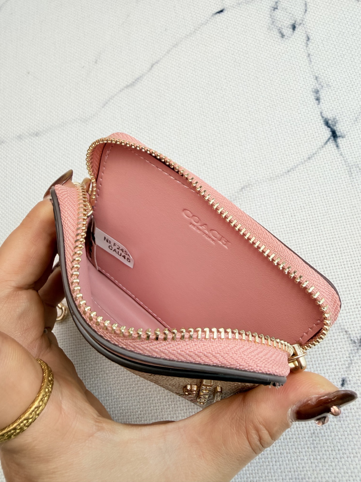 Coach Coach粉色花卉CAU45链条卡包