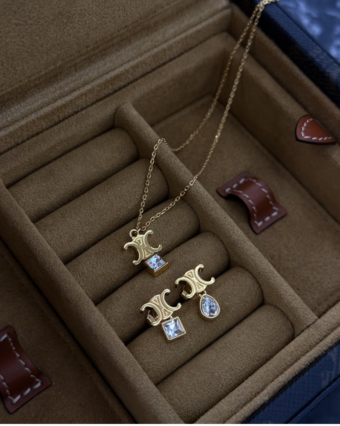 Celine Triomphe Asymmetric Crystal Stud Earrings earrings Gold-tone metal with clear faceted crystals one pear-cut one princess-cut One Size post stud approx 1 2cm drop length