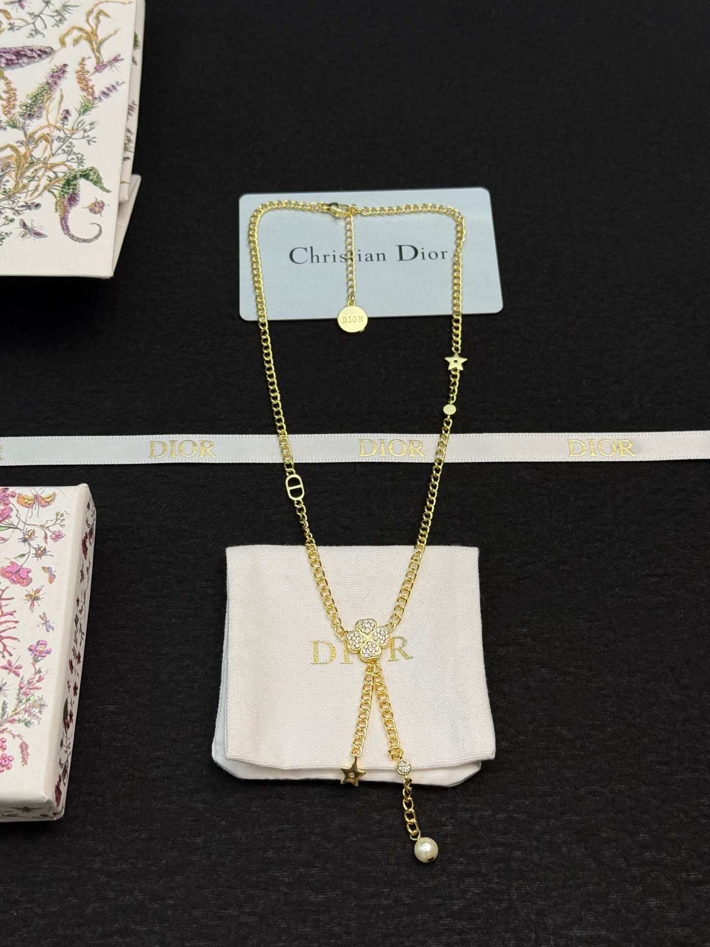 dior gold star pearl drop lariat necklace