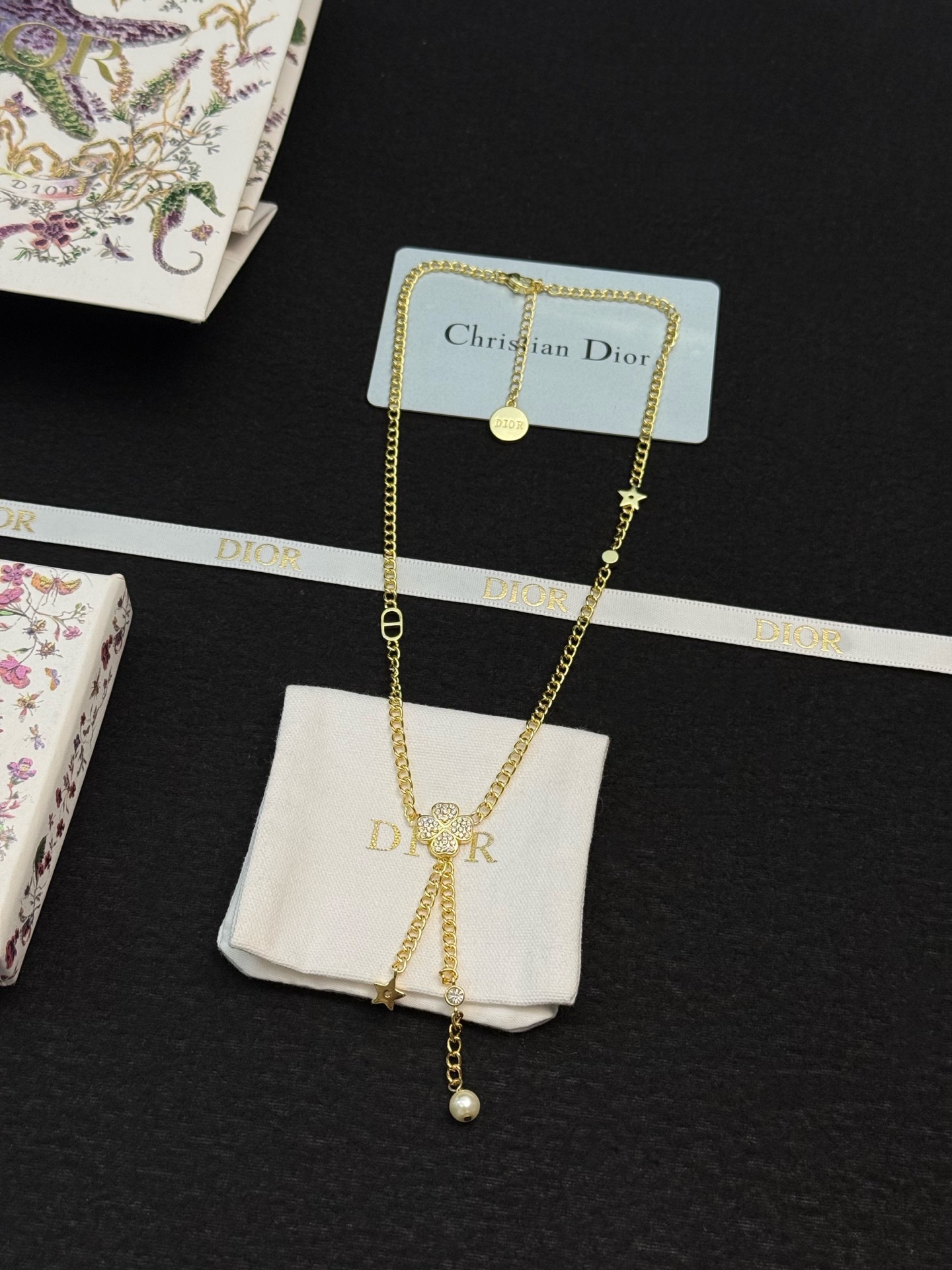 dior gold star pearl drop lariat necklace
