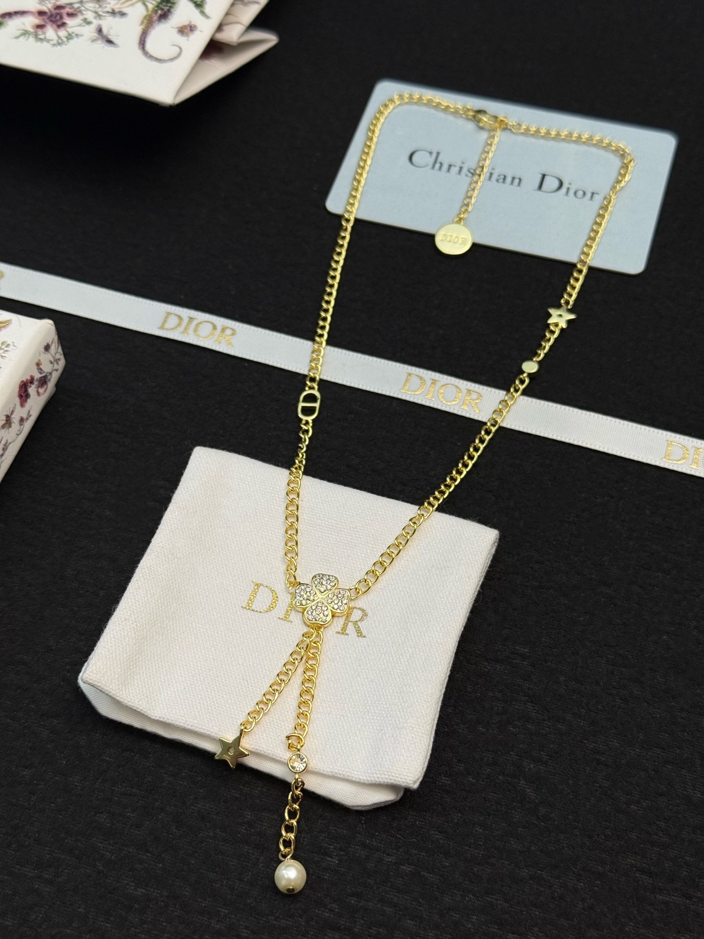 dior gold star pearl drop lariat necklace
