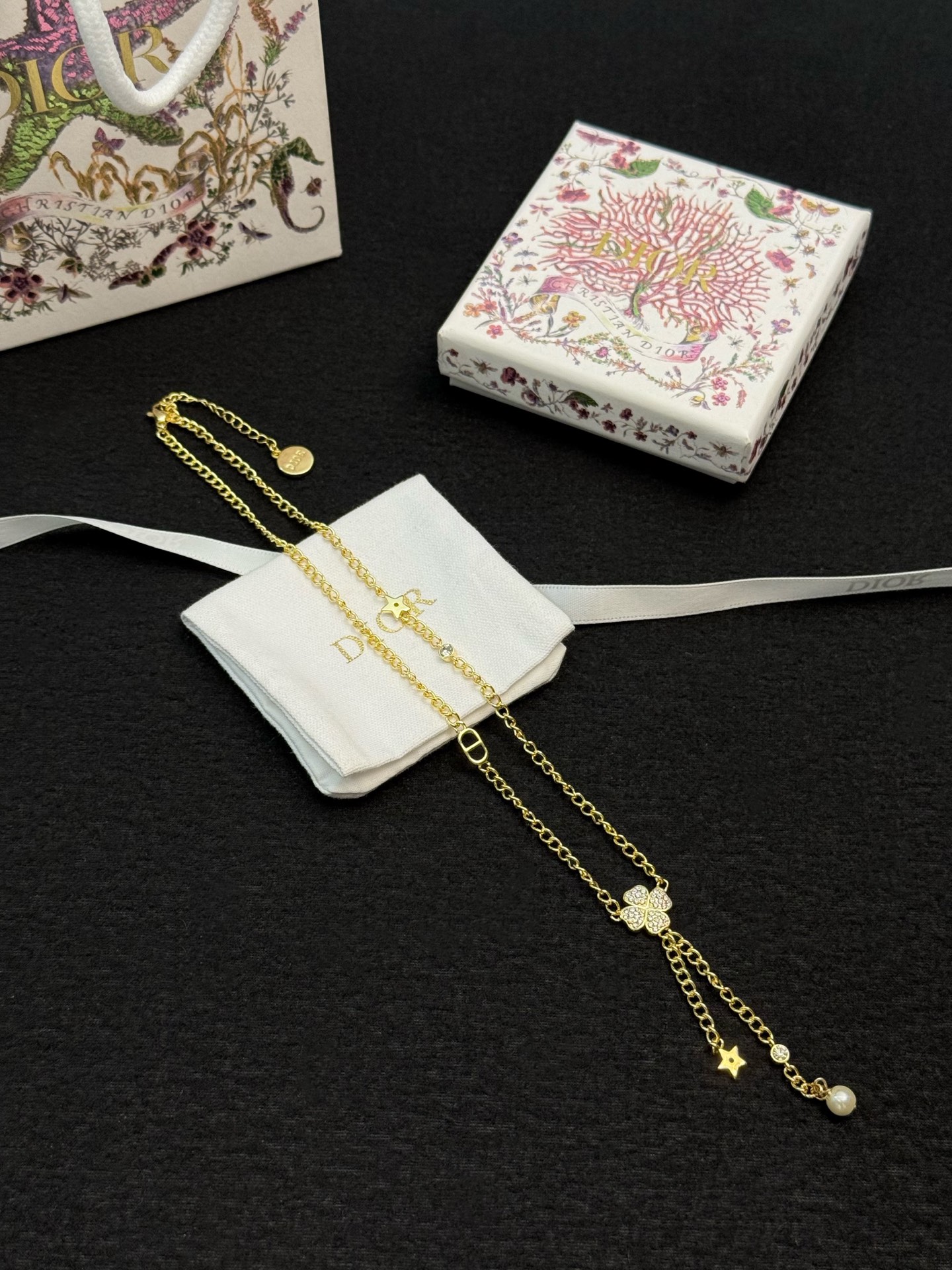 dior gold star pearl drop lariat necklace
