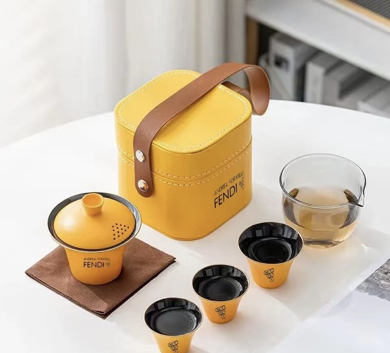 Fendi tea set featuring vibrant yellow accents, embodying refined - Comprehensive