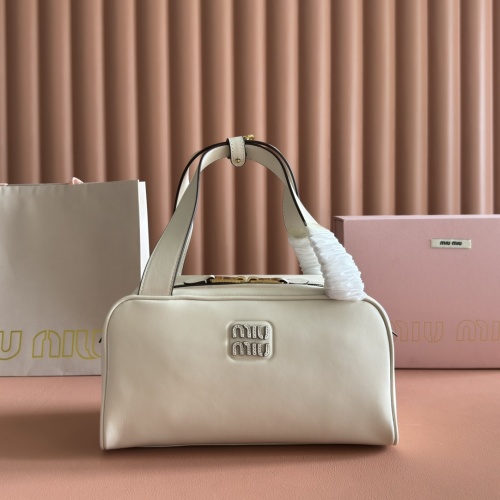 Miu Miu Leather Handbag - Compact & Functional, Elegant Logo, Subtle Sheen 1 Miu Miu Leather Handbag - Compact & Functional, Elegant Logo, Subtle Sheen