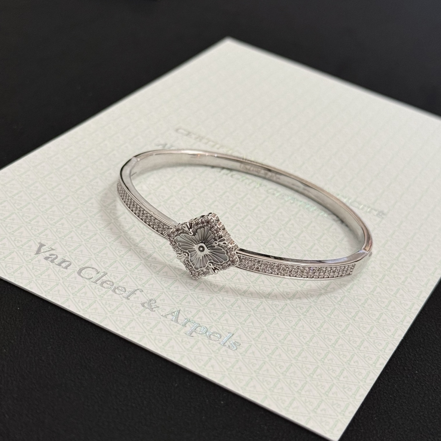 Van Cleef Arpels Alhambra bracelet silver-toned metal with clear diamond accents and silver guilloche clover motif 17cm