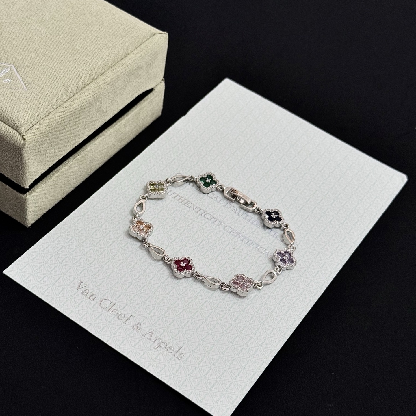 Van Cleef Arpels Alhambra bracelet Silver-toned metal with multicolor gemstones pink red champagne yellow purple dark blue green accented by white diamonds 17cm