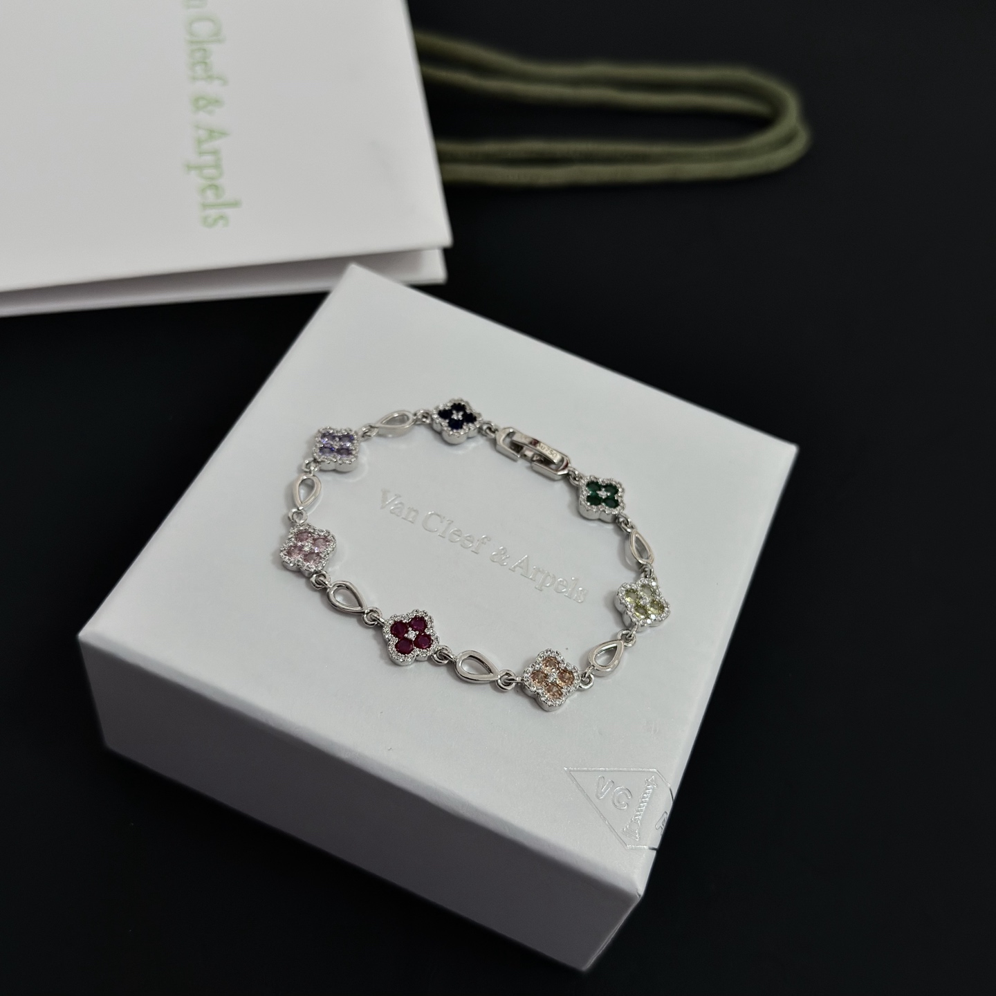 Van Cleef Arpels Alhambra bracelet Silver-toned metal with multicolor gemstones pink red champagne yellow purple dark blue green accented by white diamonds 17cm