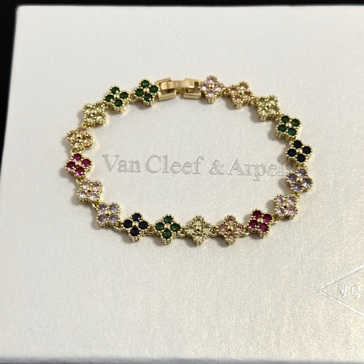 Van Cleef Arpels Alhambra bracelet yellow gold with multicolor gemstones green red black light pink purple champagne 18cm