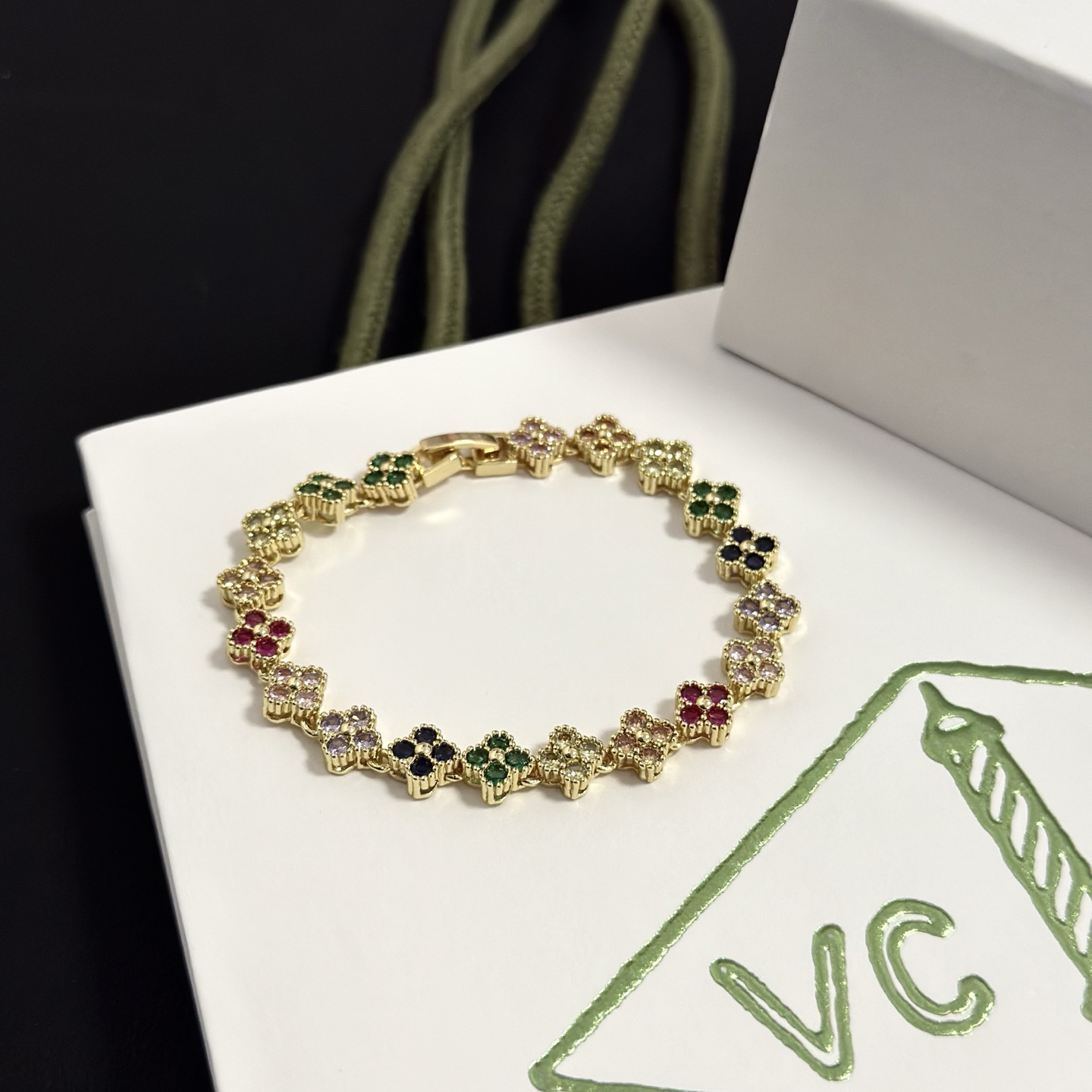 Van Cleef Arpels Alhambra bracelet yellow gold with multicolor gemstones green red black light pink purple champagne 18cm
