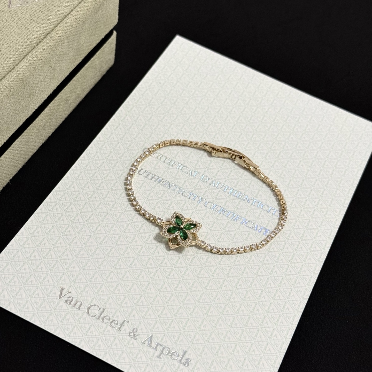Van Cleef Arpels Four-leaf Clover bracelet gold-toned metal with clear diamonds and green gemstones 17cm