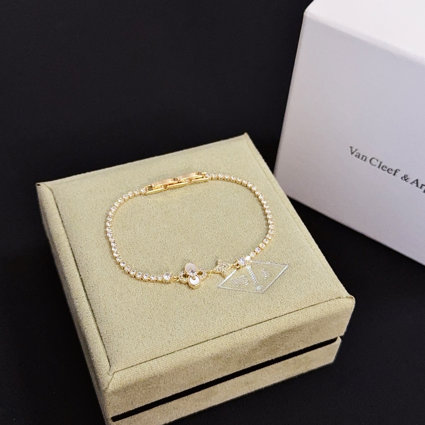 Van Cleef Arpels Alhambra bracelet yellow gold with clear diamond accents and mother-of-pearl detail 17cm