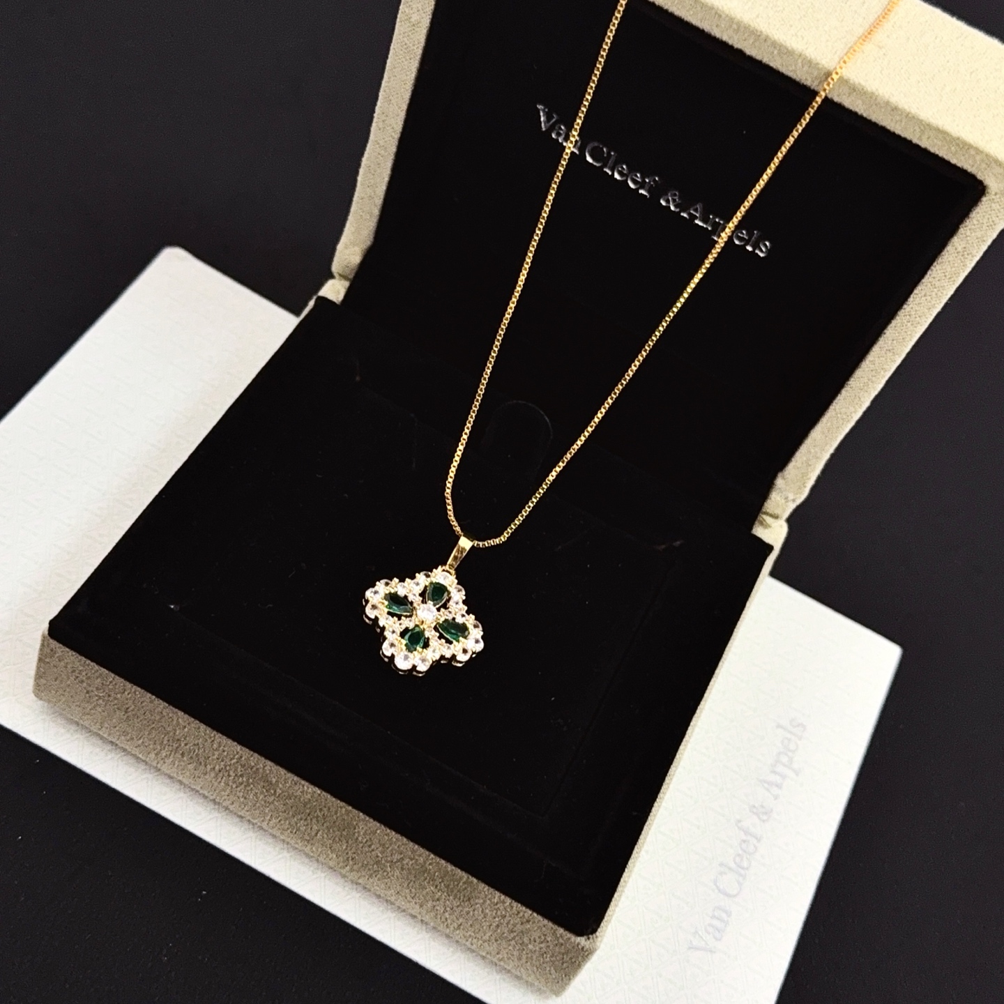 Van Cleef Arpels Alhambra necklace yellow gold metal with green gemstones and clear diamond accents 42cm