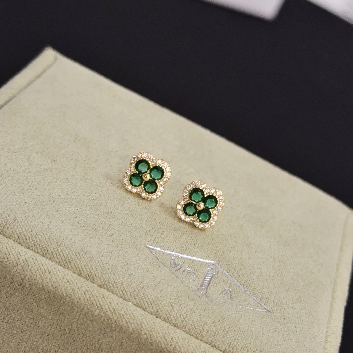 Van Cleef Arpels Alhambra earrings yellow gold metal with emerald green gemstones and white diamond accents 9mm stud diameter