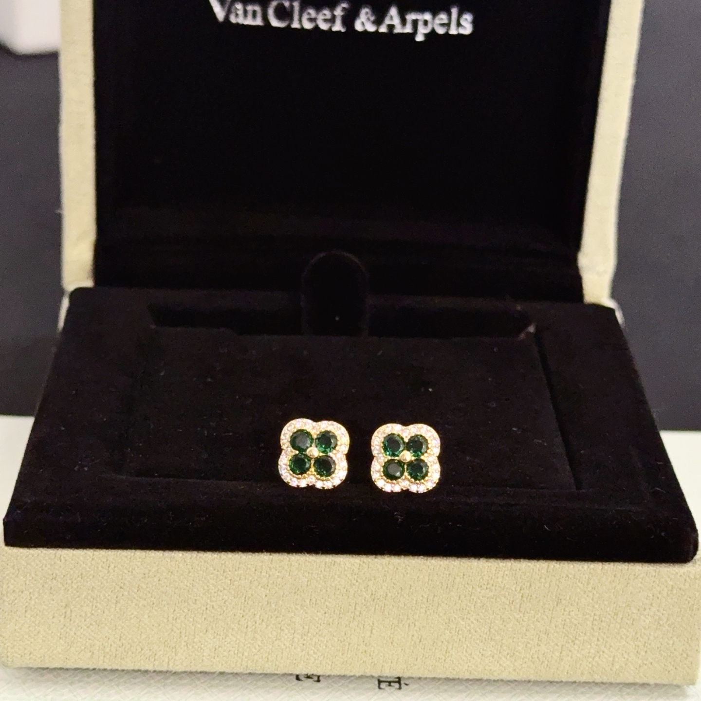 Van Cleef Arpels Alhambra earrings yellow gold metal with emerald green gemstones and white diamond accents 9mm stud diameter
