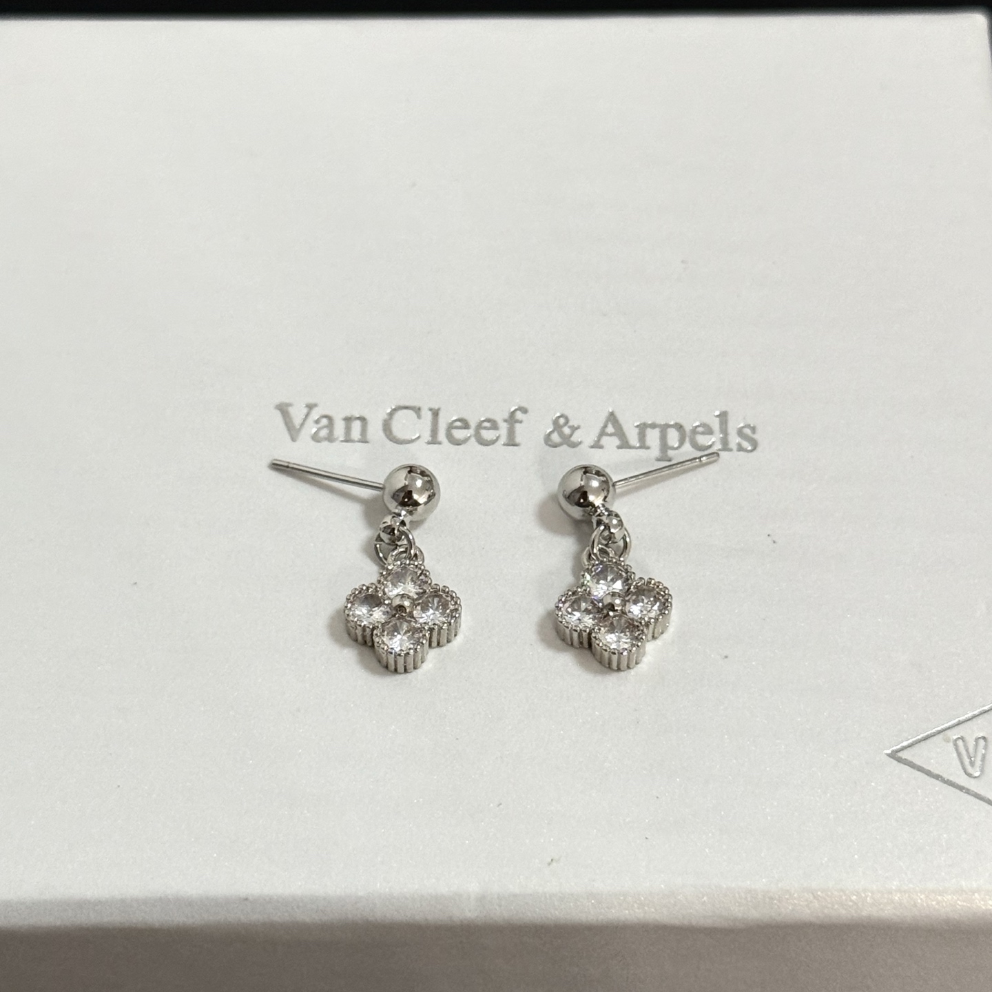 Van Cleef Arpels Alhambra earrings silver-toned white gold metal with clear diamond accents 10mm pendant drop