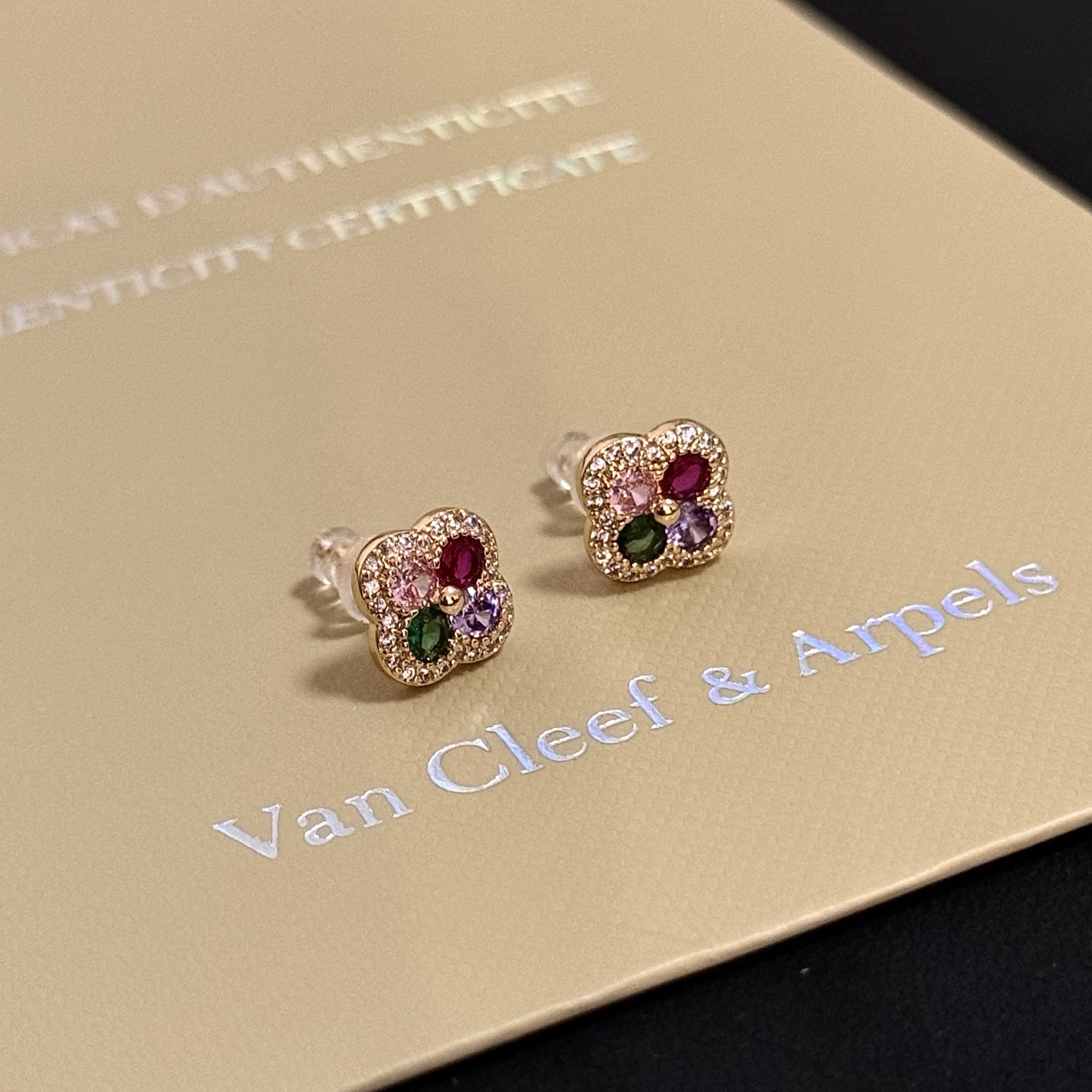 Van Cleef Arpels Alhambra earrings yellow gold metal with white diamond pave green pink purple and ruby red gemstones 8mm stud diameter