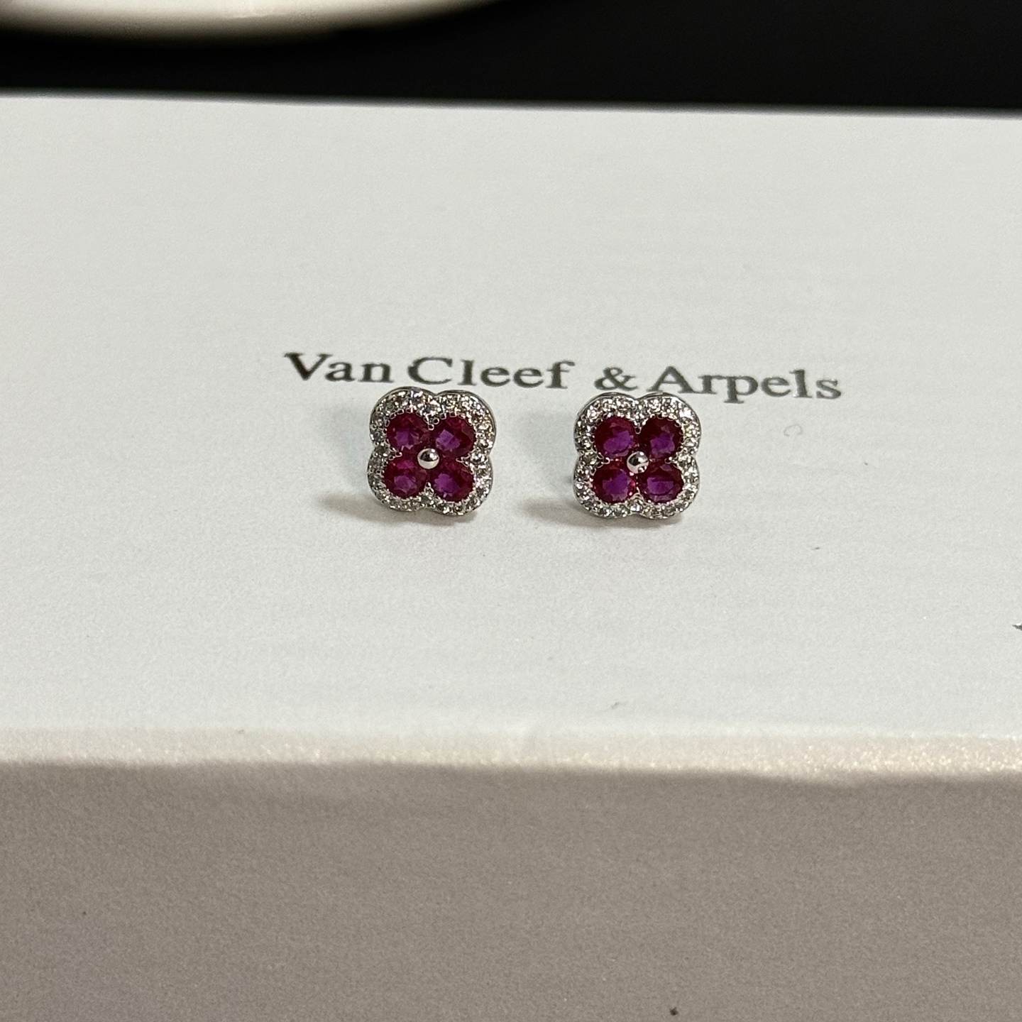 Van Cleef Arpels Alhambra earrings white gold metal ruby red gemstones white diamond accents 8mm stud diameter