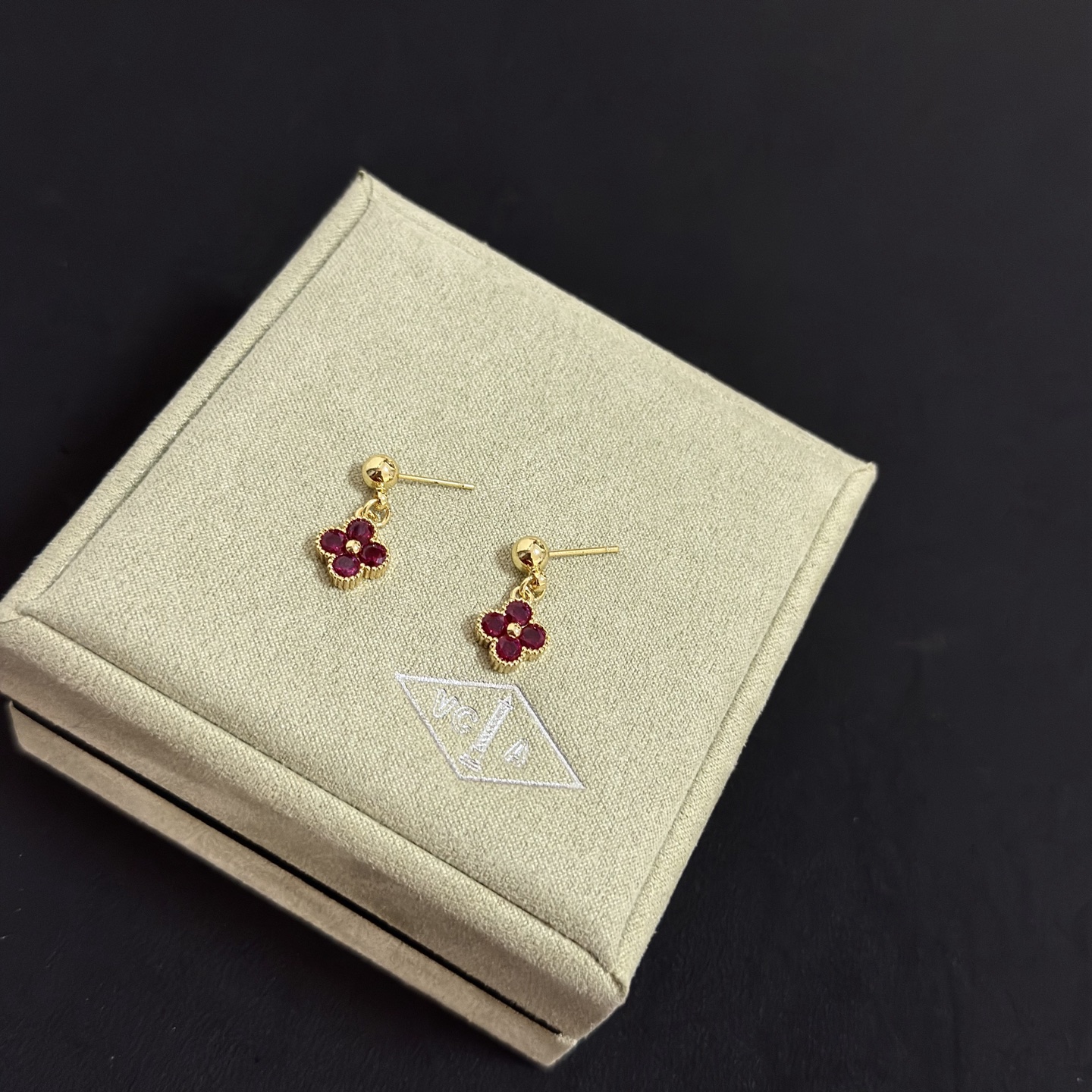 Van Cleef Arpels Alhambra earrings yellow gold metal with deep ruby red gemstones 1 2cm drop length