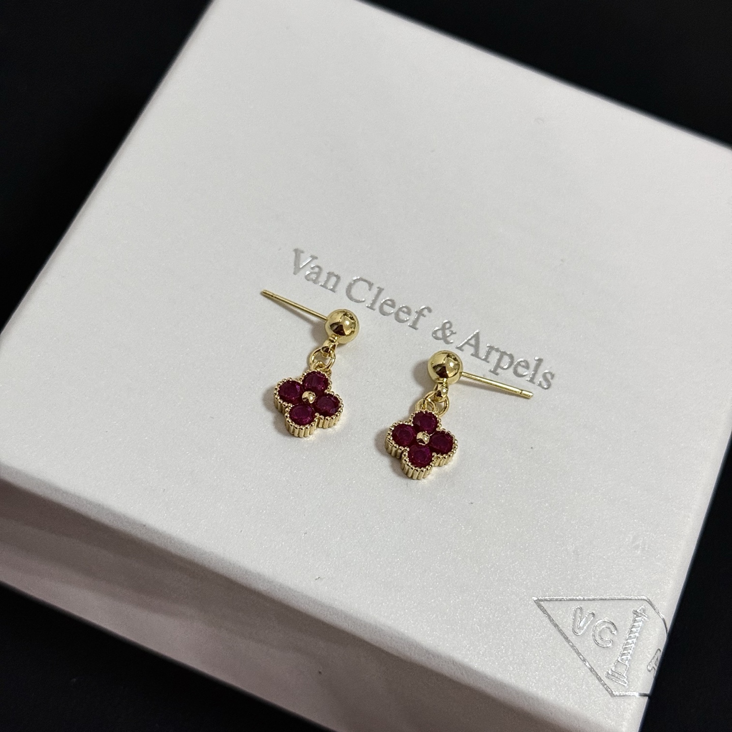 Van Cleef Arpels Alhambra earrings yellow gold metal with deep ruby red gemstones 1 2cm drop length