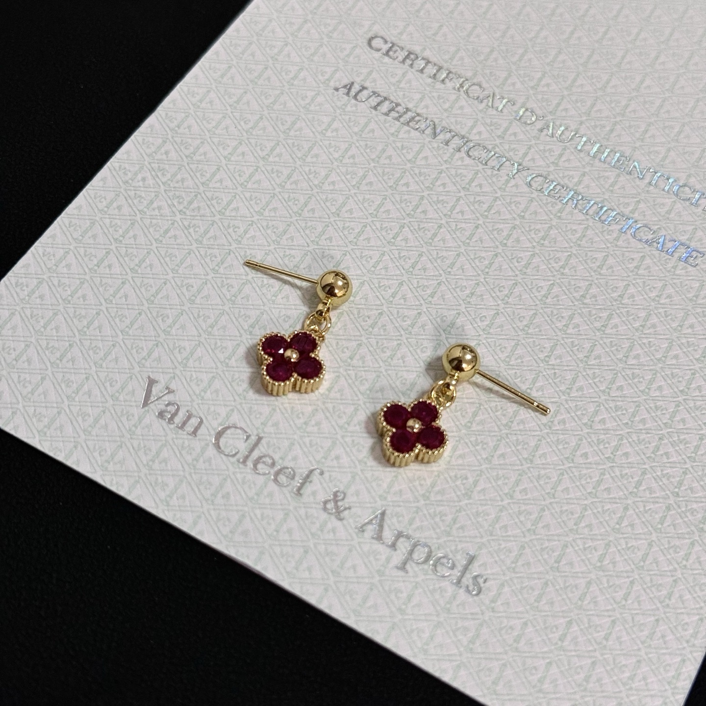 Van Cleef Arpels Alhambra earrings yellow gold metal with deep ruby red gemstones 1 2cm drop length