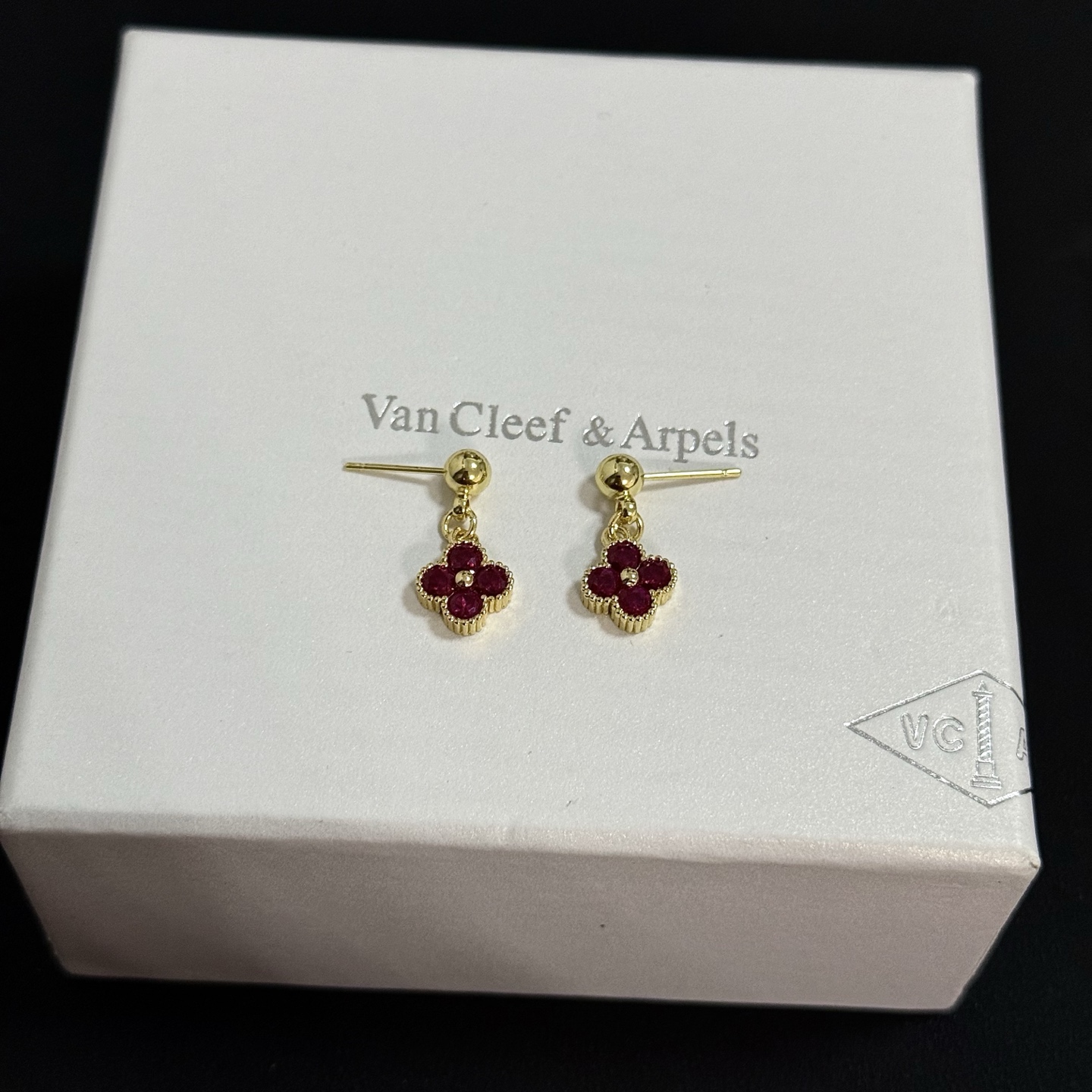Van Cleef Arpels Alhambra earrings yellow gold metal with deep ruby red gemstones 1 2cm drop length