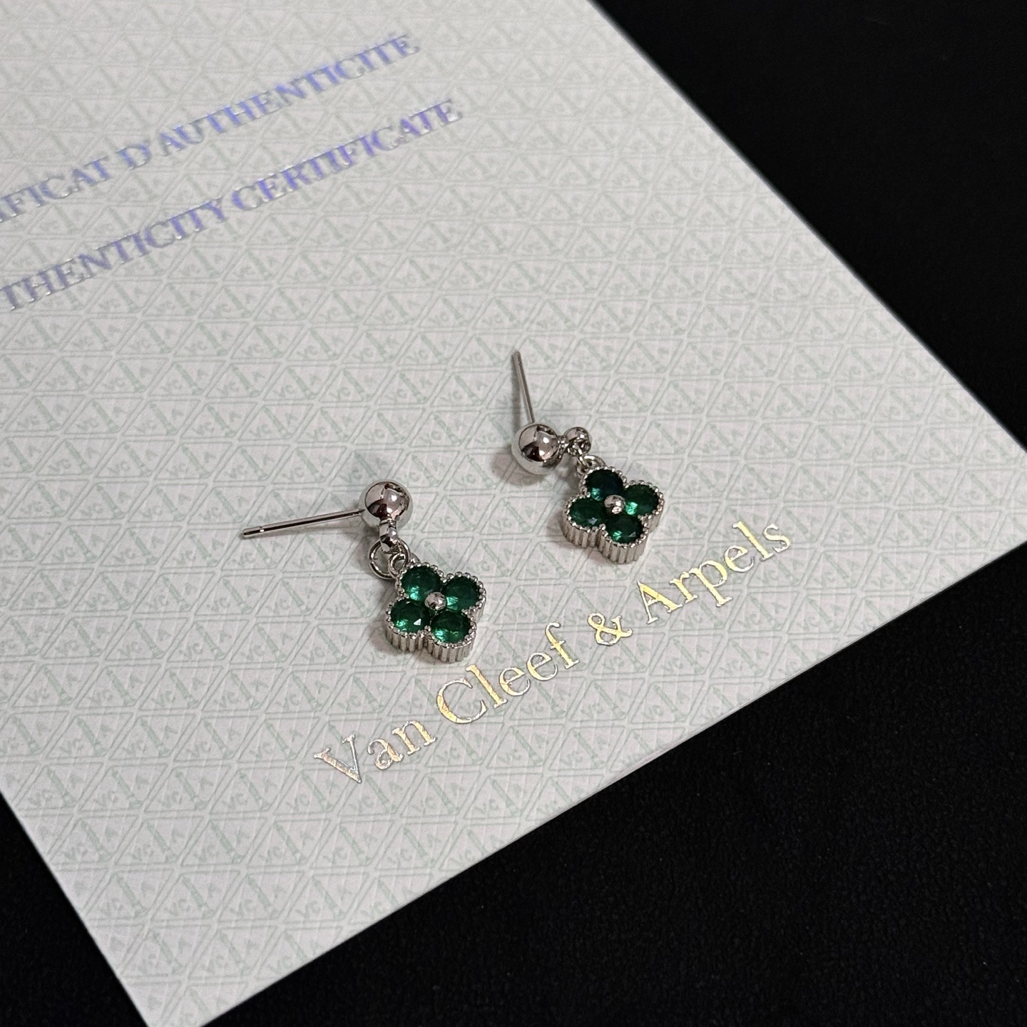 Van Cleef Arpels Alhambra earrings Silver-toned metal with emerald green gemstones One size