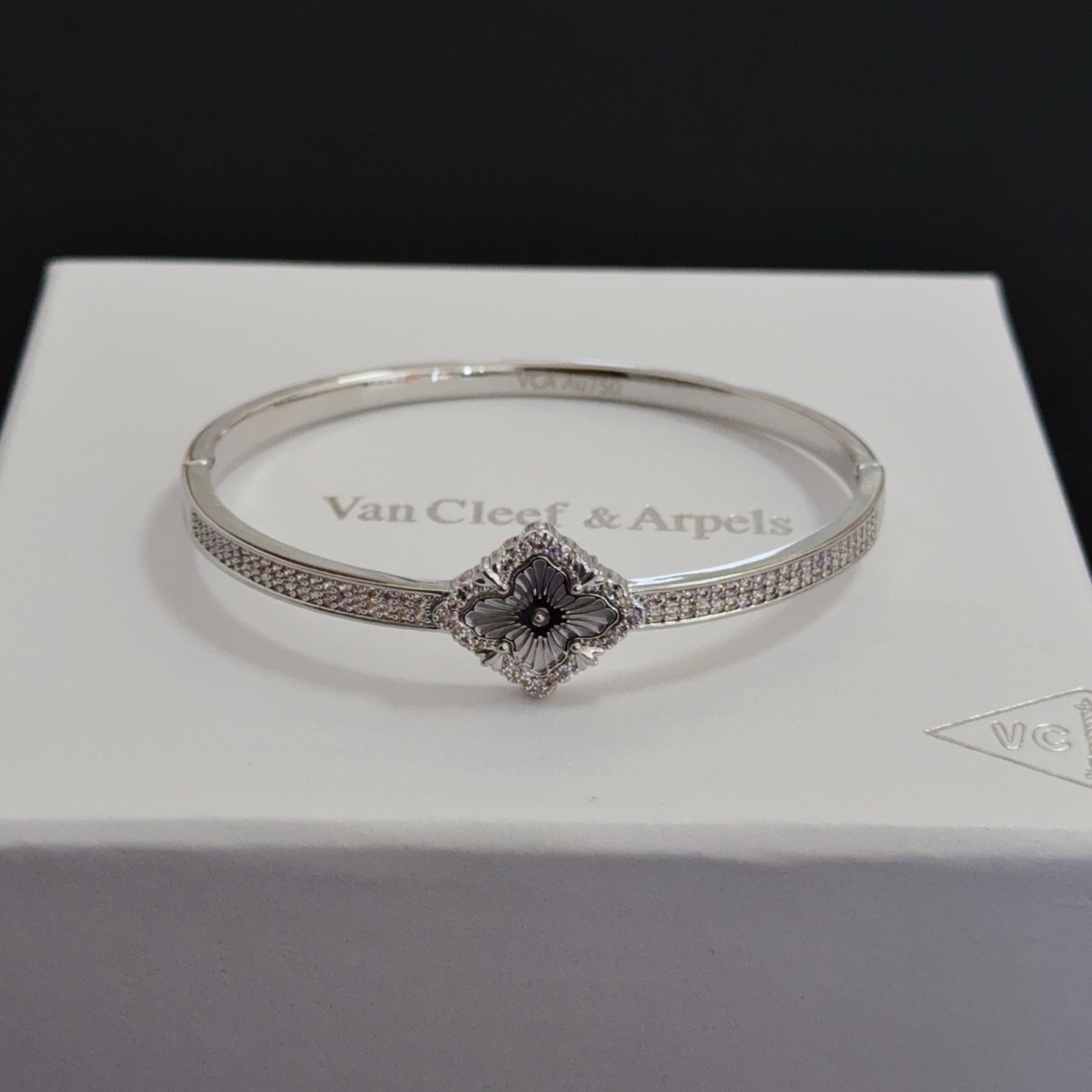 Van Cleef Arpels Alhambra bracelet silver-toned metal with clear diamond accents and grey engraved clover motif 17cm
