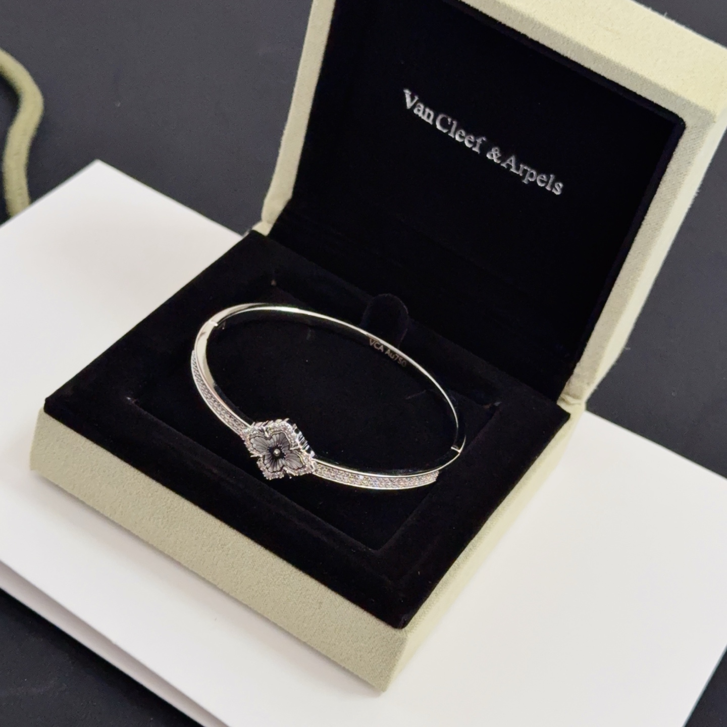 Van Cleef Arpels Alhambra bracelet silver-toned metal with clear diamond accents and grey engraved clover motif 17cm