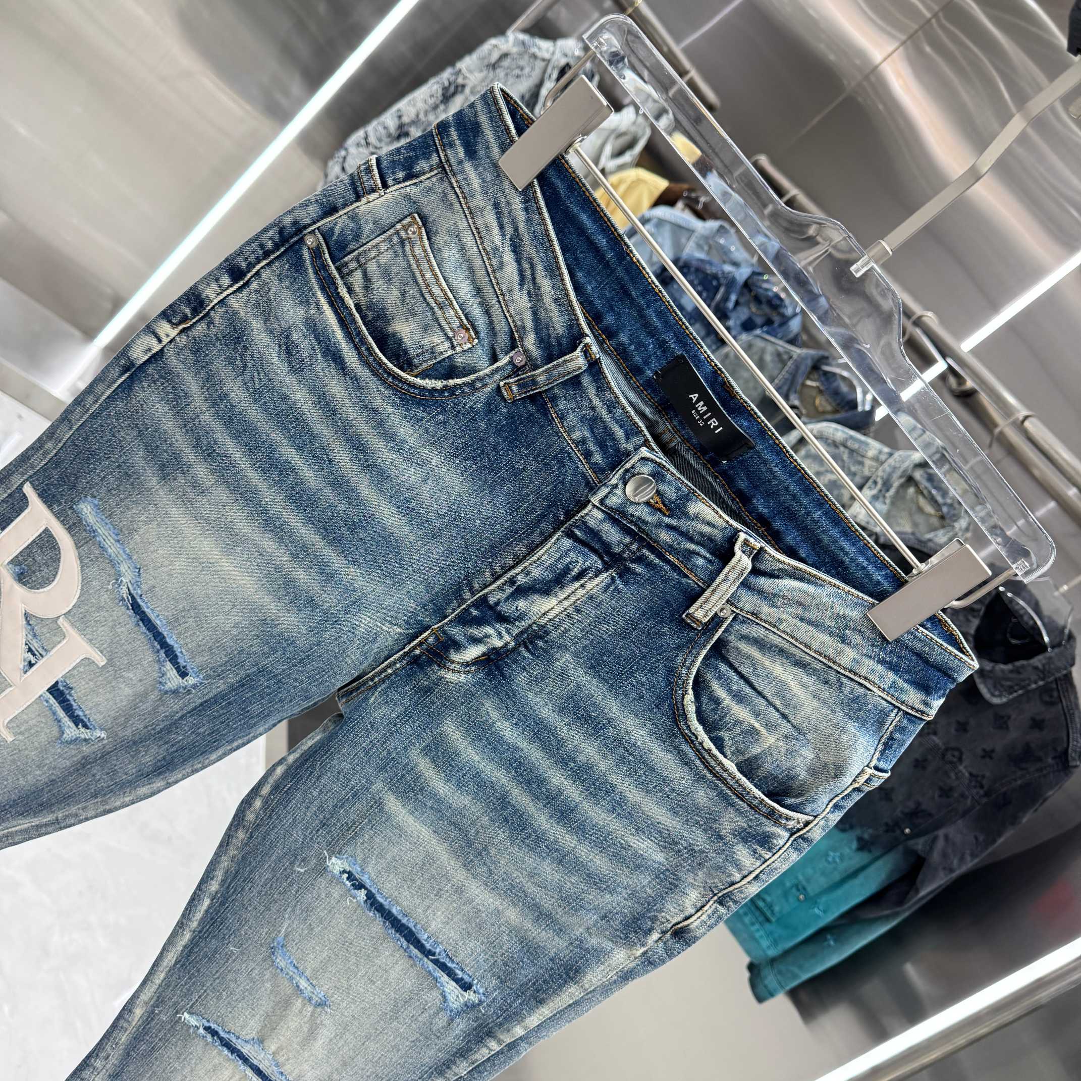 Amiri Amiri 破洞刺绣图案工艺街头潮流修身小脚弹力牛仔裤