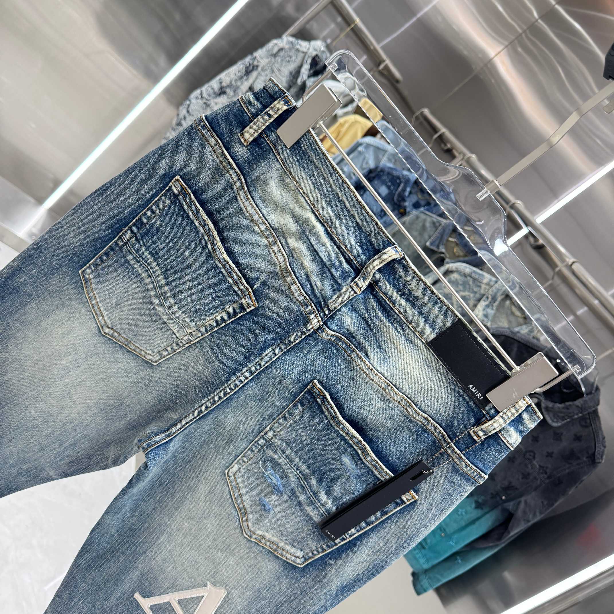 Amiri Amiri 破洞刺绣图案工艺街头潮流修身小脚弹力牛仔裤