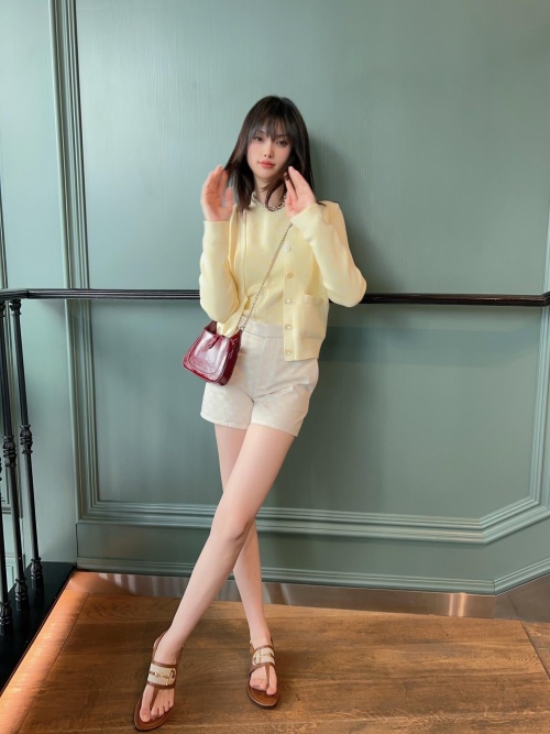 Elegant V-Neck Cardigan with Subtle Logo Pattern - Spring/Summer Collection 1 Elegant V-Neck Cardigan with Subtle Logo Pattern - Spring/Summer Collection
