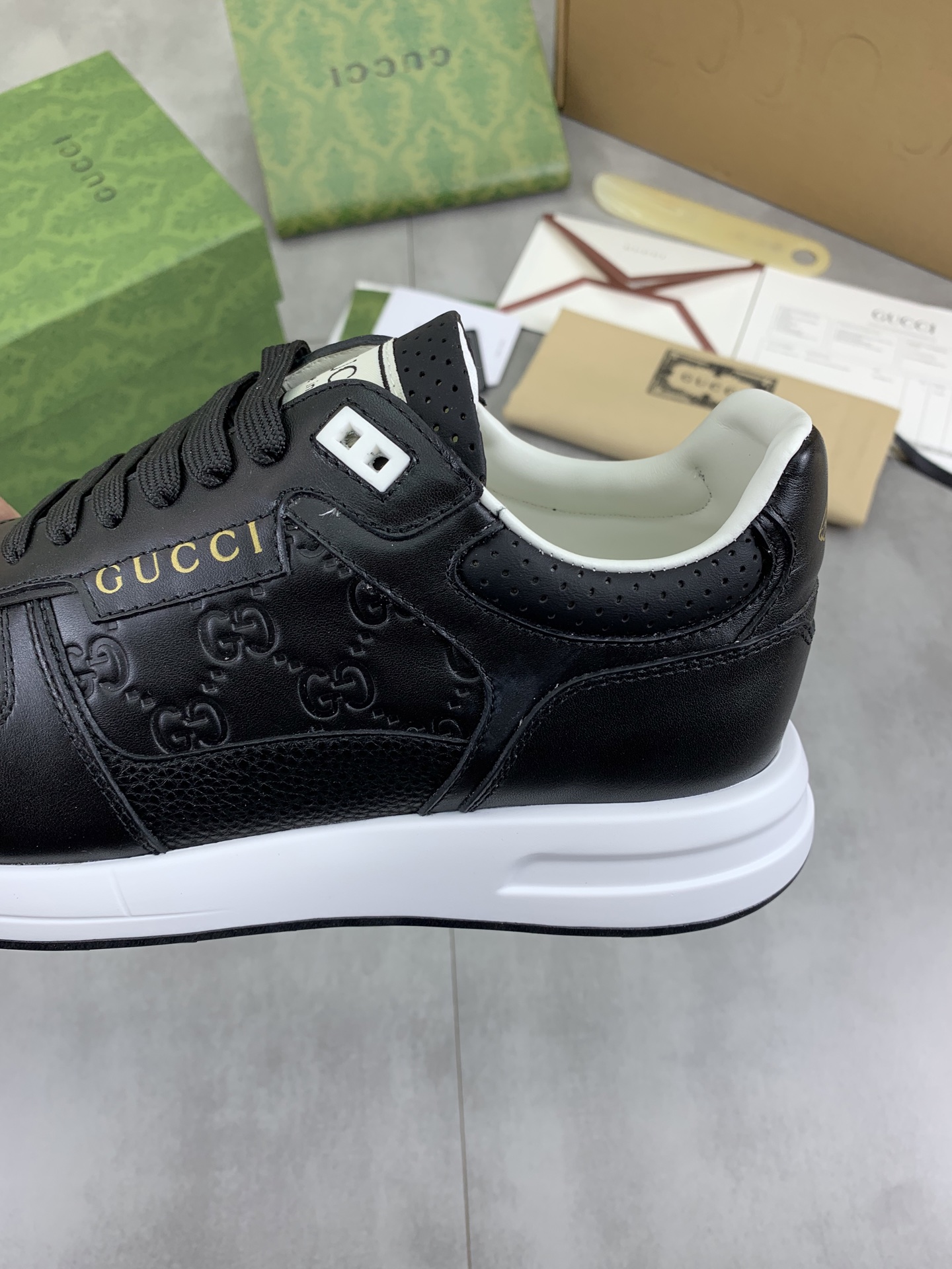 Gucci Men's Black Leather Lace-Up Sneakers with Embossed GG Pattern 8 i1743613681276 5334 0 6