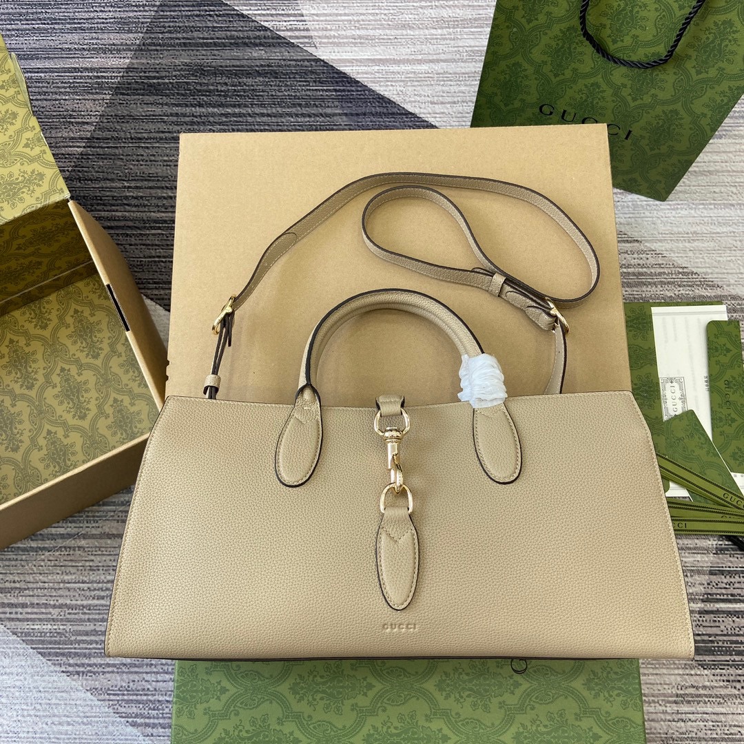 GUCCI GG Jackie серыя, сярэдняя сумка-тоўт, шэры, высакаякасная скура, натуральная зярністая фактура, здымны рамень, верхняя ручка, зашпілька-крук, штодзённыя паездкі на працу