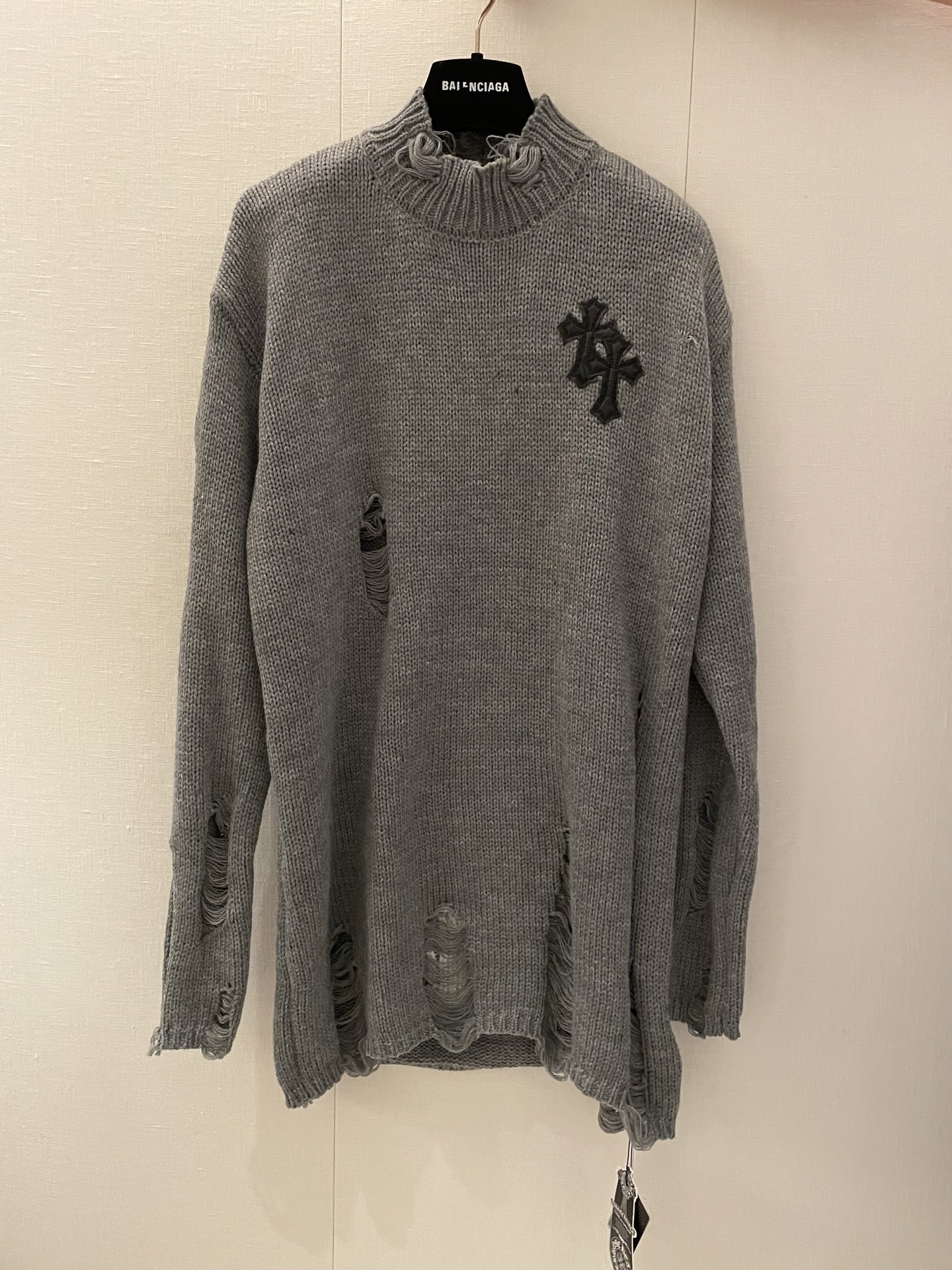 Distressed Knit Sweater with Cross Patch, Longline Design and Unique Ripped Details