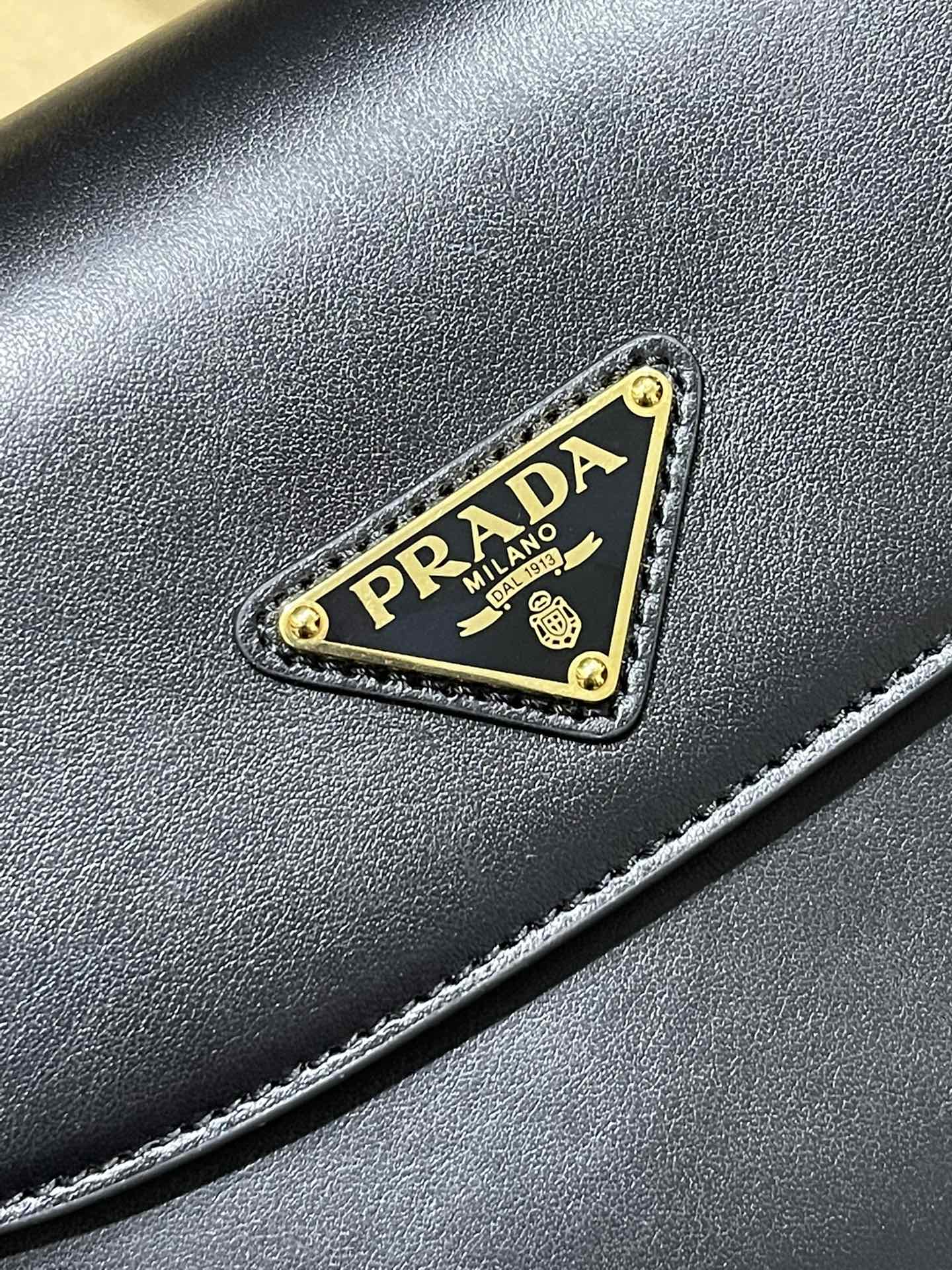 Prada The introduction of the triangle card is perfect