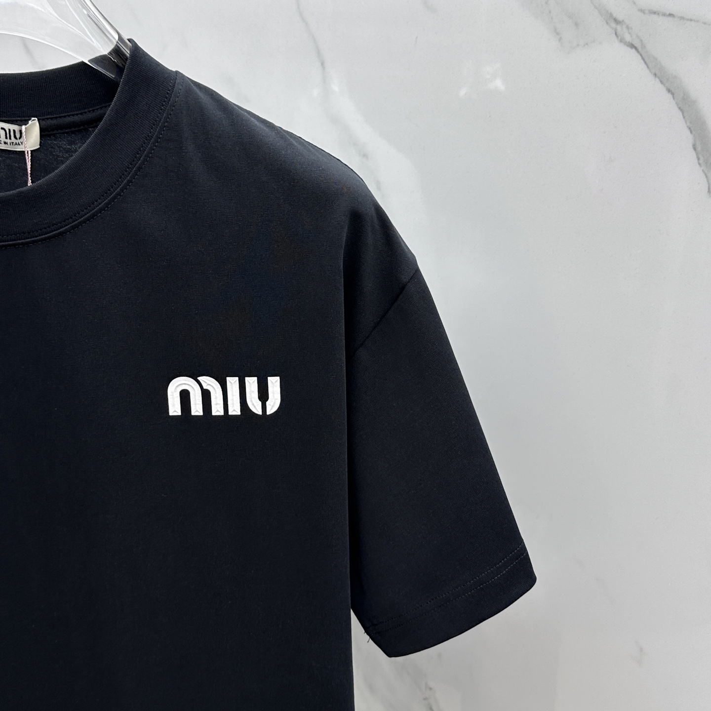 Miu Miu T-Shirt: Spring/Summer Crewneck Tee with Embossed Logo 6 i1744221191446 205 0 4